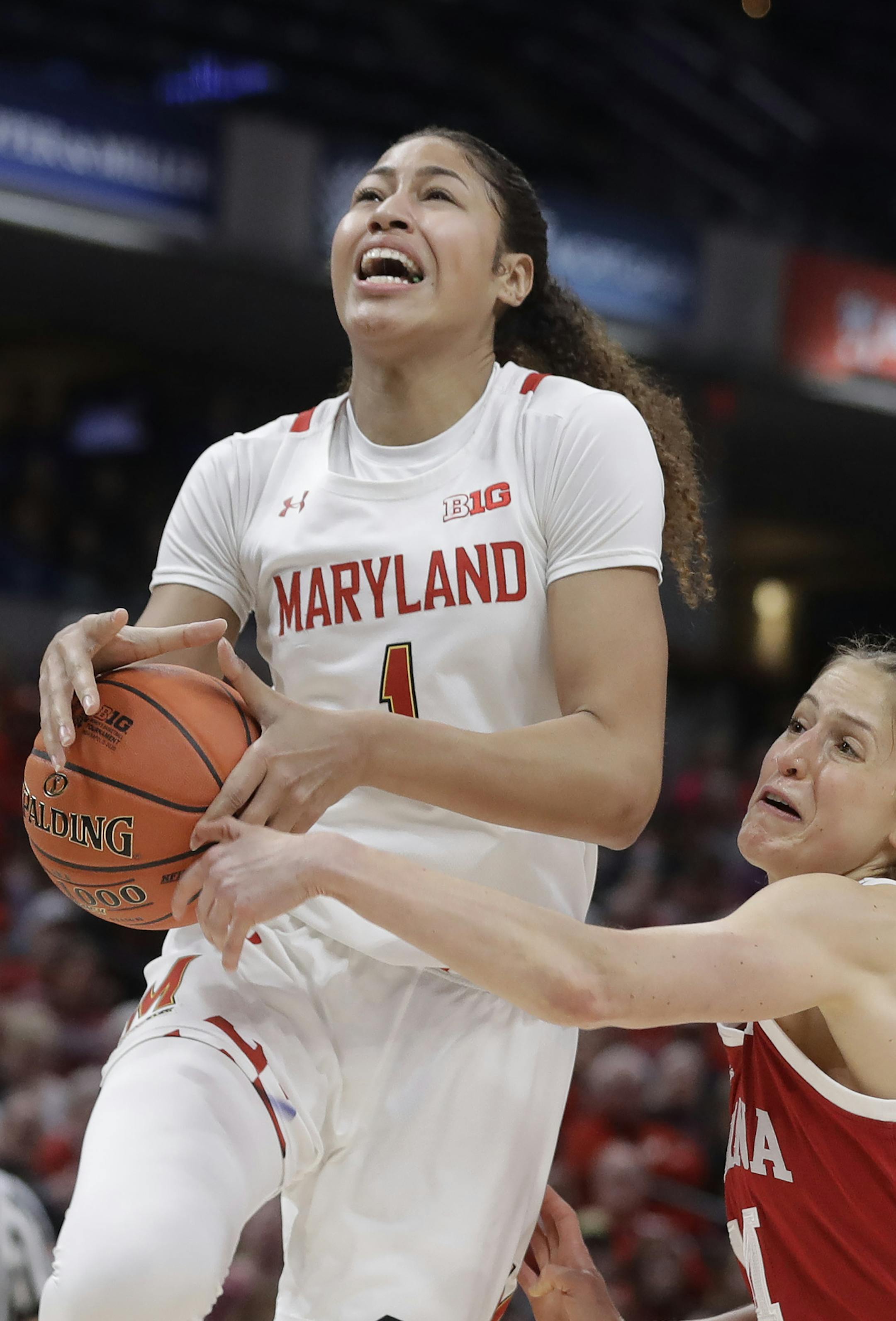Maryland's Shakira Austin (1) puts up a shot against Indiana's Ali Patberg (14) during the first half of an NCAA college basketball semifinal game at the Big Ten Conference tournament, Saturday, March 7, 2020, in Indianapolis. (AP Photo/Darron Cummings)