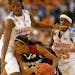 Stanford's Candice Wiggins (center) is tied up by Tennessee's Nicky Anosike and Alberta Auguste during the first half of the NCAA Women's Championship