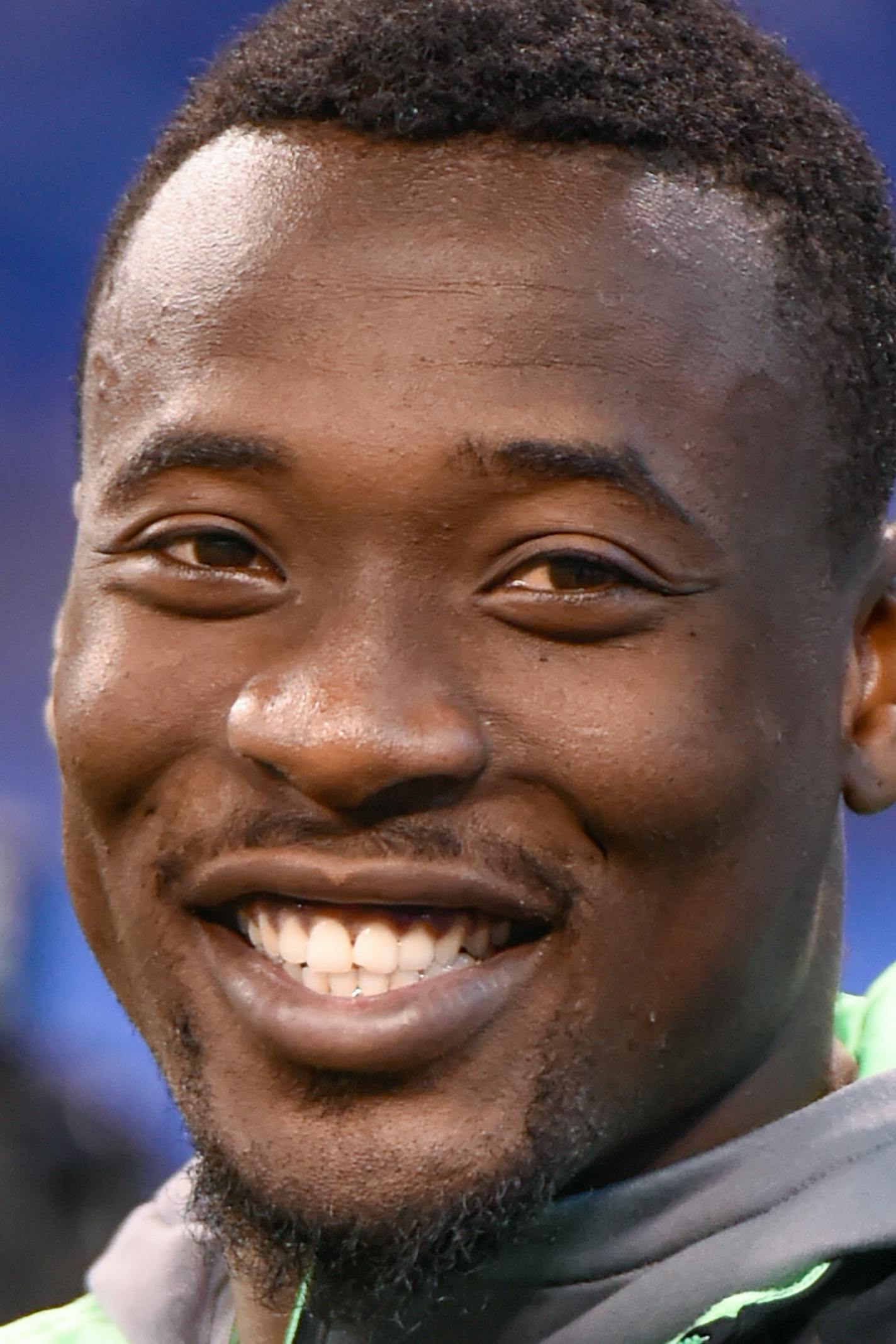 Clemson defensive back Mackensie Alexander laughs while watching players workout at the NFL football scouting combine, Monday, Feb. 29, 2016, in Indianapolis. (AP Photo/L.G. Patterson)