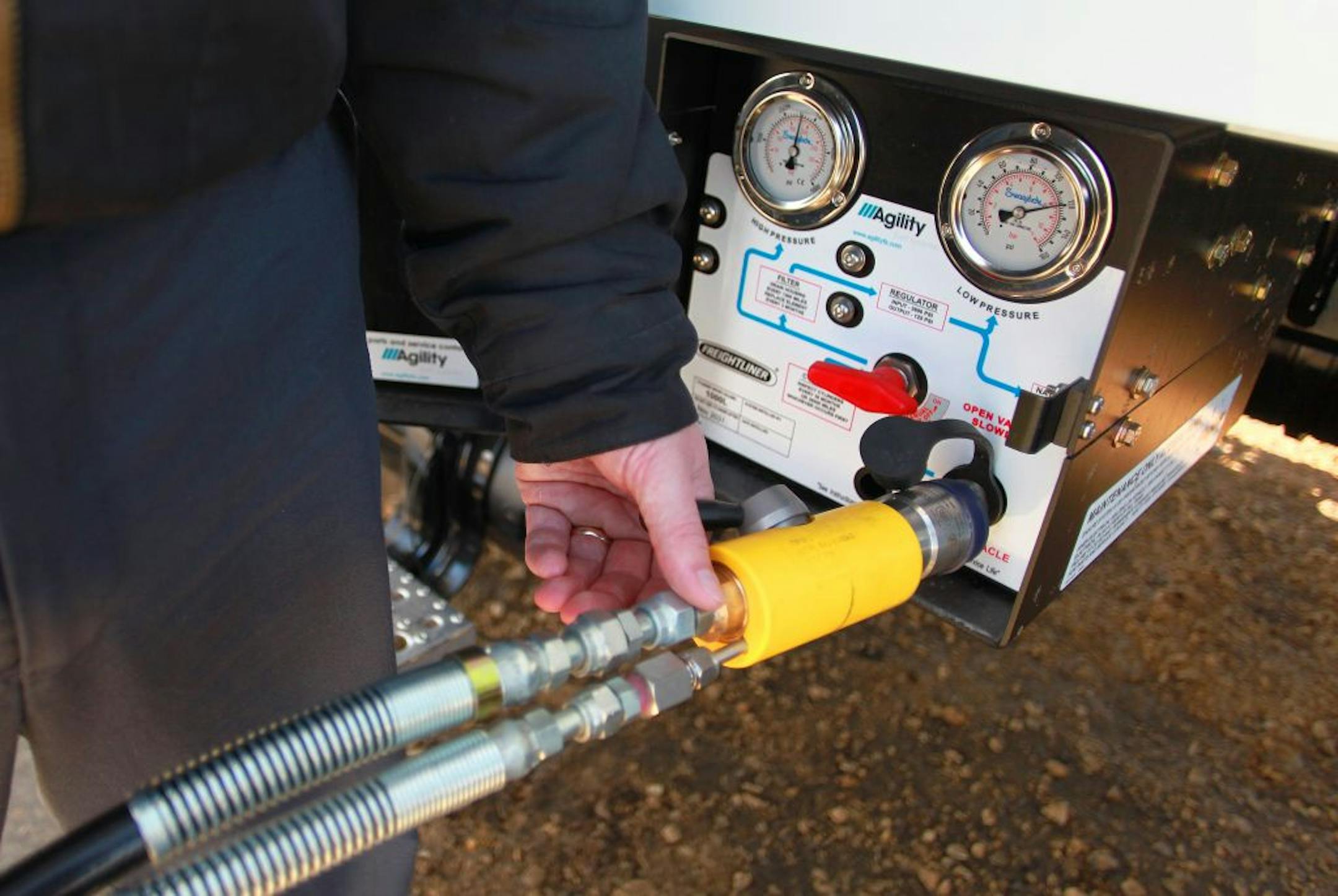Gabe Johnson, a truck driver for Andersen Logistics in Menomonie, fuels a new Compressed Natural Gas over-the-road truck. Six new CNG powered trucks will run between Andersen's Bayport, Minn. headquarters and its facility in Menomonie, Wisconsin.Photo courtesy of Anderson Windows.