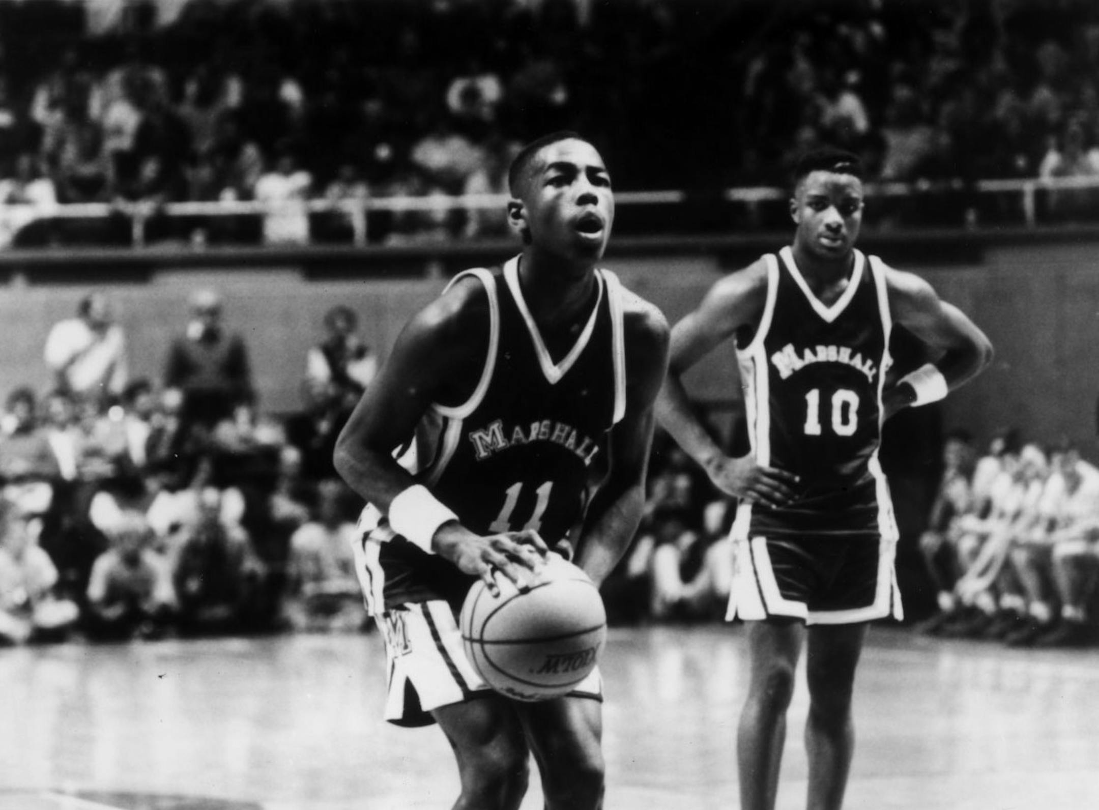 Arthur Agee (center left foreground, #11) stars in the 1994 movie documentary "Hoop Dreams." Player #10 in background right is not identified. Photo courtesy of Fine Line Features.
