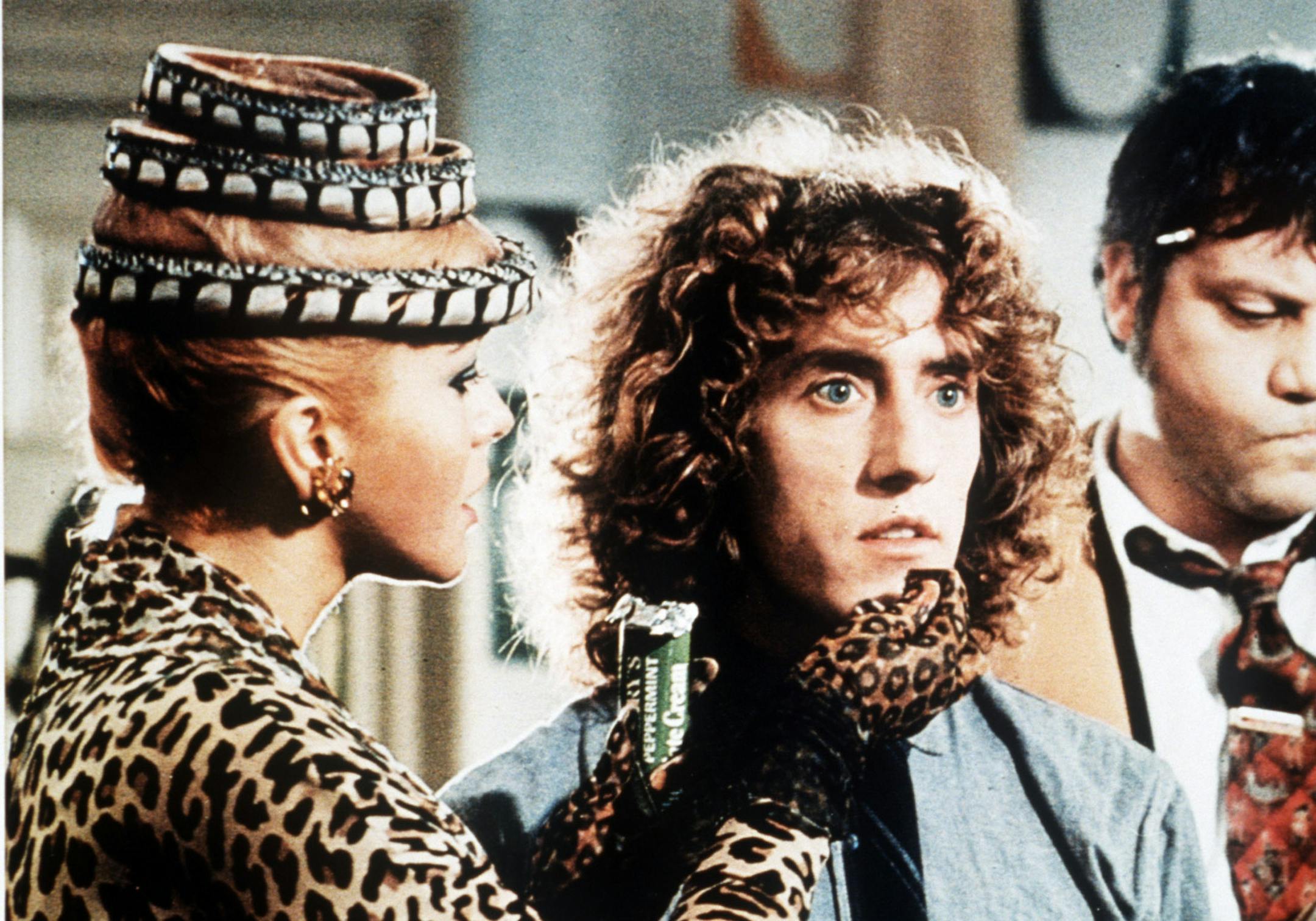 Scene from the 1975 rock opera movie "Tommy" shows Ann-Margret (at left) and Roger Daltrey (center).