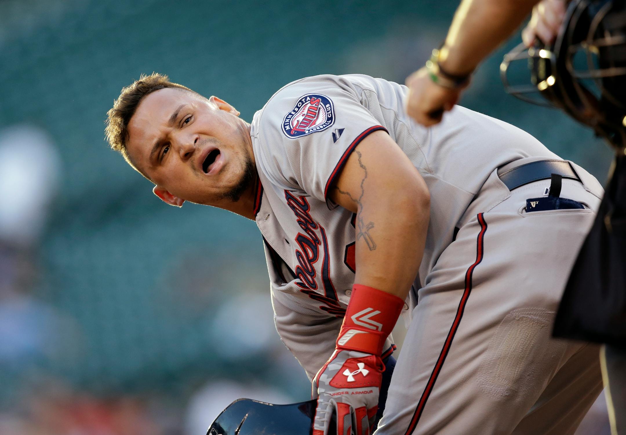The Twins' Oswaldo Arcia talked to the plate umpire after striking out against Seattle in the fourth inning Monday. Arcia went 2-for-3 with a double, but the Twins lost 2-0.