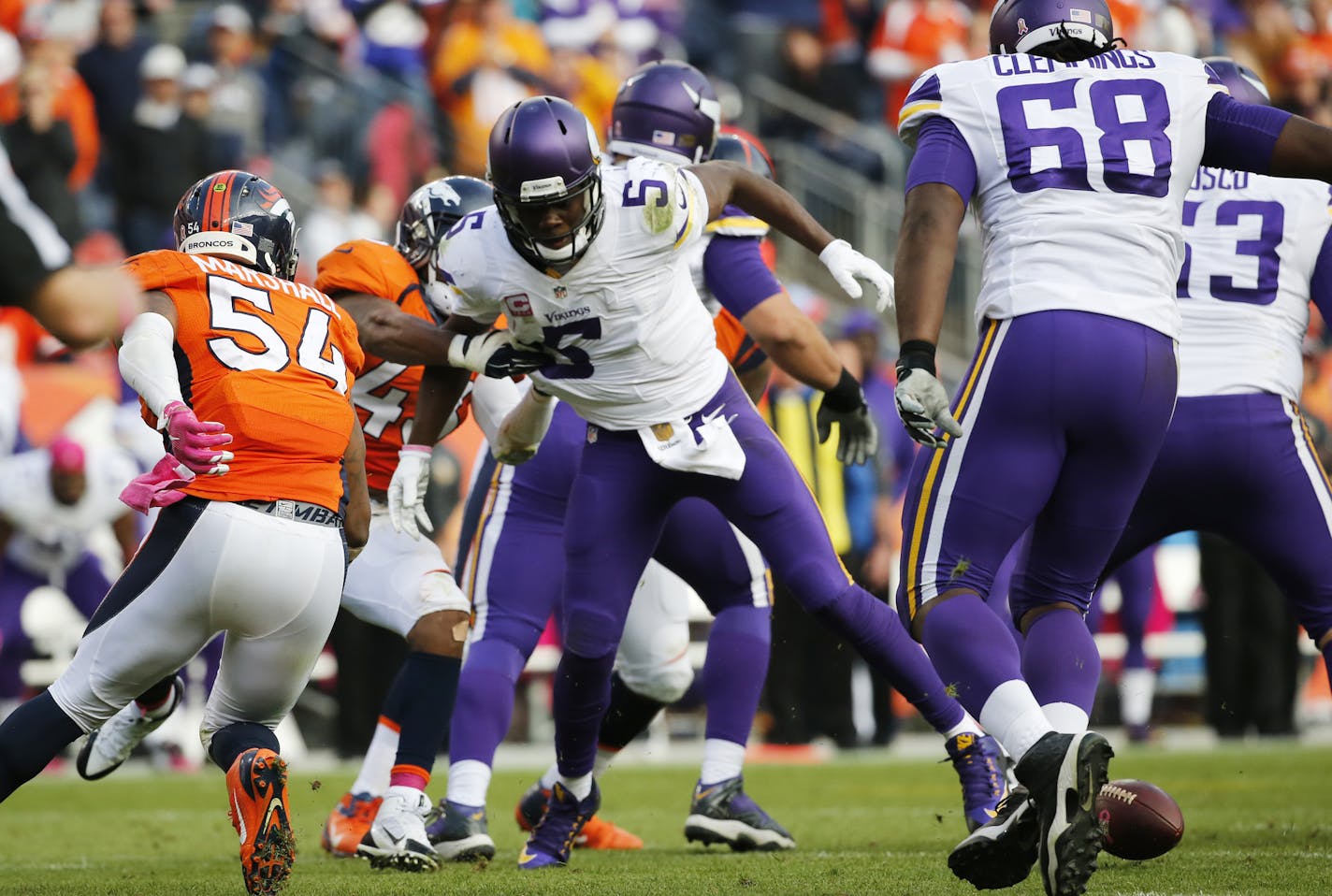 Denver Broncos strong safety T.J. Ward (43) strips the ball from the hands of Minnesota Vikings quarterback Teddy Bridgewater during an NFL football game between the Denver Broncos and the Minnesota Vikings Sunday, Oct. 4, 2015, in Denver. (AP Photo/Jack Dempsey) ORG XMIT: OTK