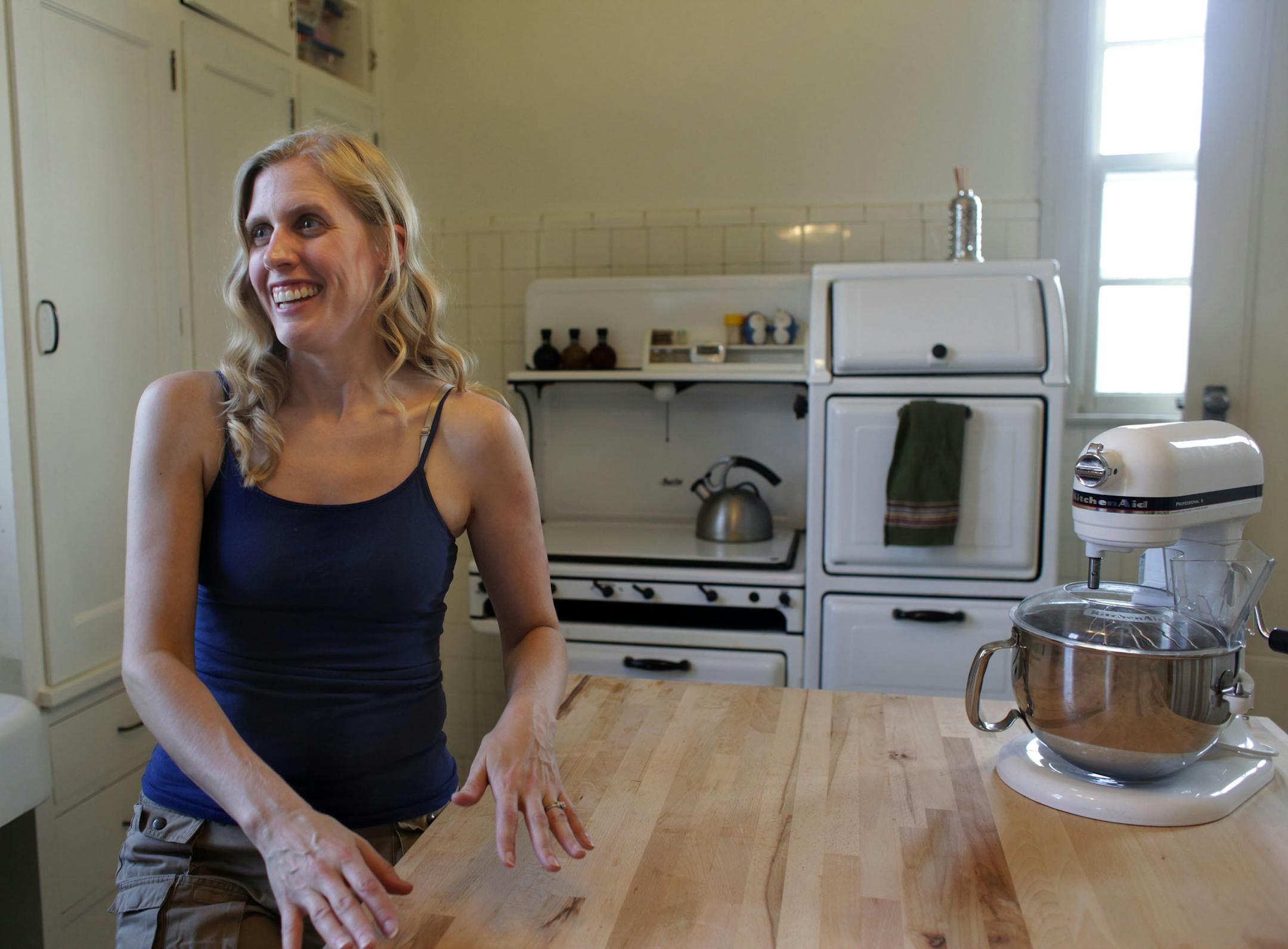 Alissa Pier talks about the kitchen in their home on Thursday afternoon. ] Architect/homeowner Alissa Pier used original 1920s blueprints to restore this home in north Minneapolis, after a tornado tore off its roof. MONICA HERNDON monica.herndon@startribune.com Minneapolis, MN 07/24/14