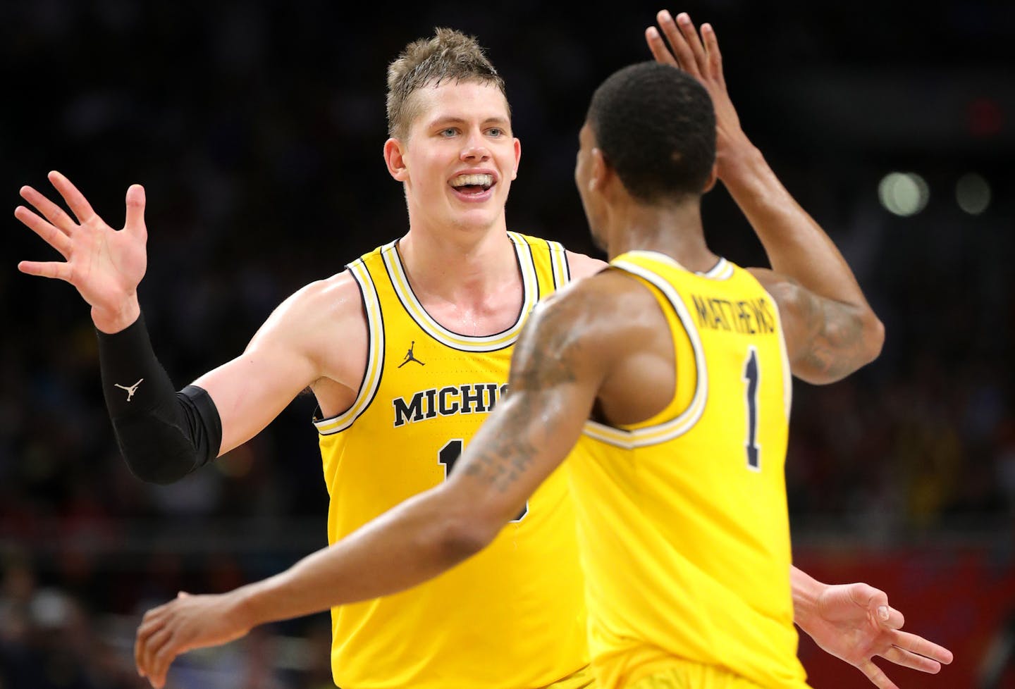 Michigan's Moe Wagner celebrated with teammate Charles Matthews after a Final Four semifinal victory over Loyola Chicago on Saturday.