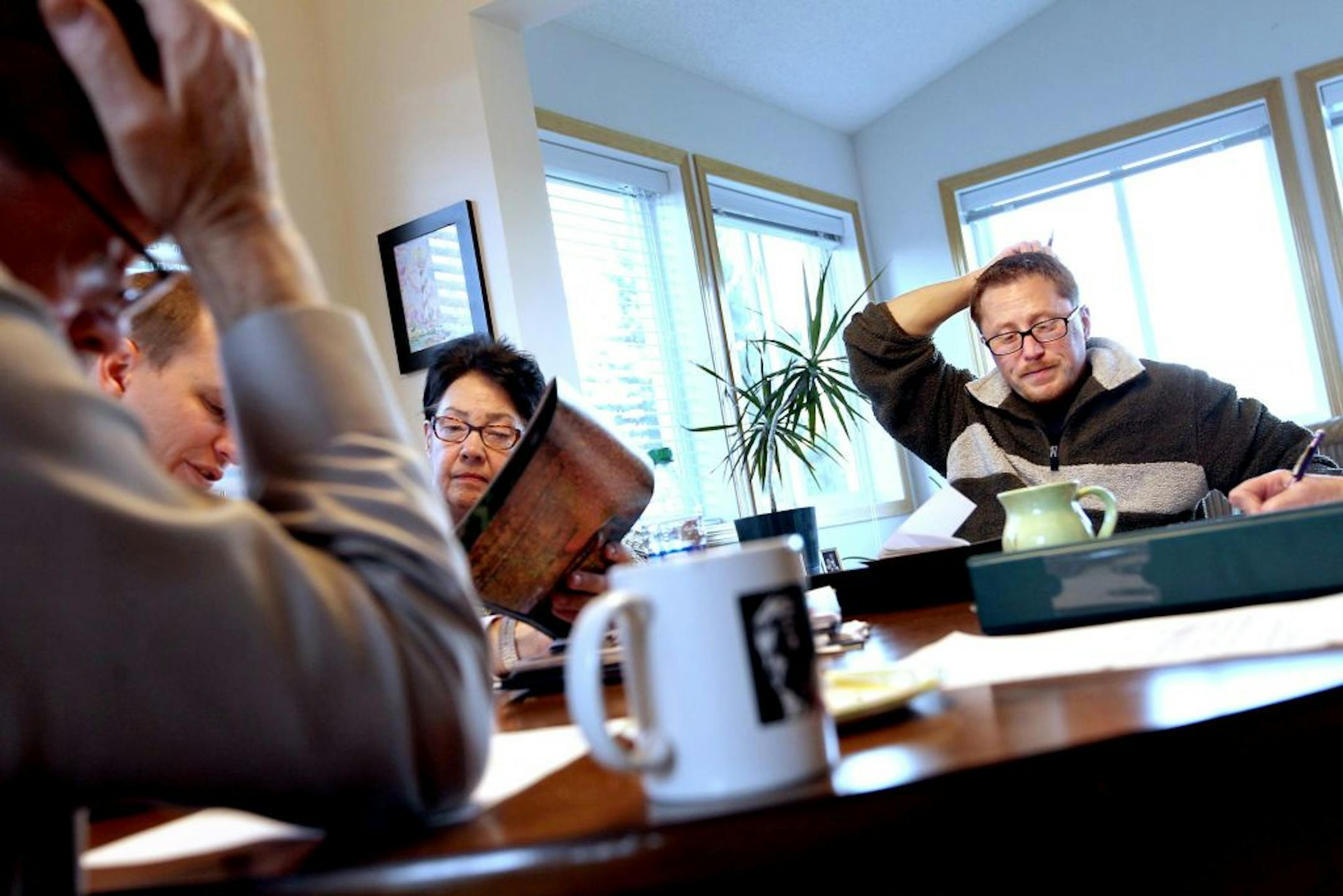 Ben Kruse, right, Republican incumbent senator from Coon Rapids-Brooklyn Park, meets with campaign manager Ryan Lorsung, second from left, media coordinator Kathie Casey, and his campaign team to go over business October 7, 2012.
