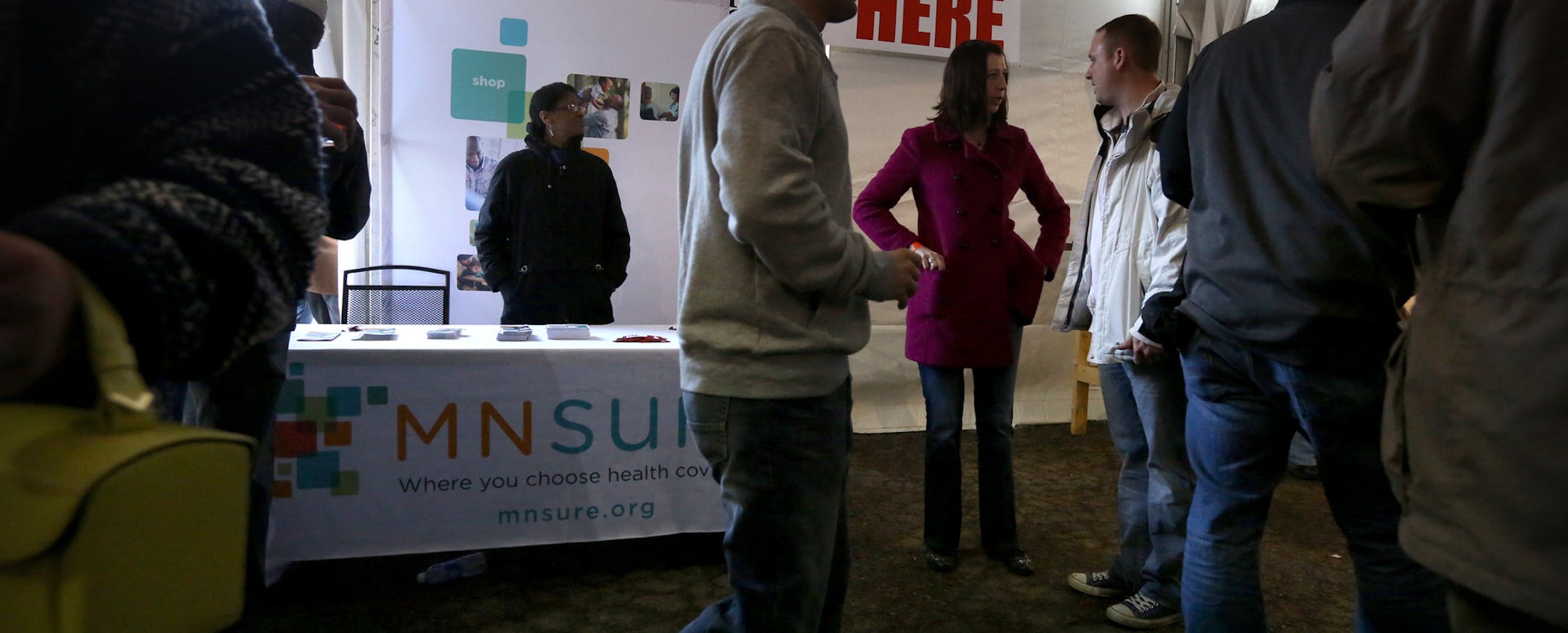 MNsure liason Makela Norris monitored an informational table at the Happy Gnome bar in St. Paul, where the Firkins Fest event was in full swing. ] JIM GEHRZ ‚Ä¢ jgehrz@startribune.com / St. Paul, MN / March 22, 2014 / 1:30 PM / BACKGROUND INFORMATION: MNsure takes its message to young people by using Hollywood spokesmen and holding sign-up events at bars and on college campuses. Right now, about 21 percent of MNsure enrollees are aged 19 to 34. MNsure people will be talking hand
