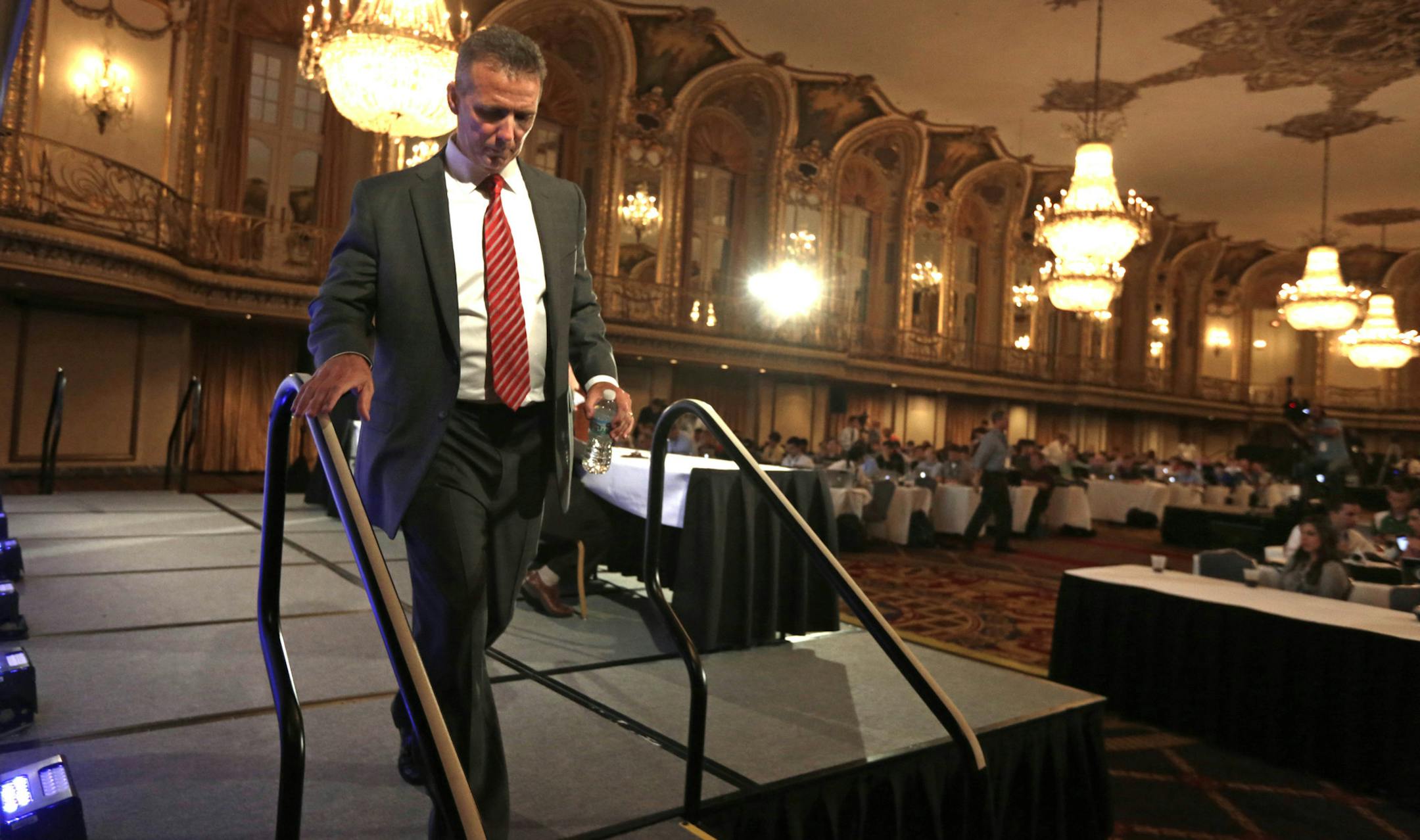 Ohio State head football coach Urban Meyer leaves the stage after speaking at the Big Ten conference football media day Wednesday, July 24, 2013, in Chicago. (AP Photo/M. Spencer Green)