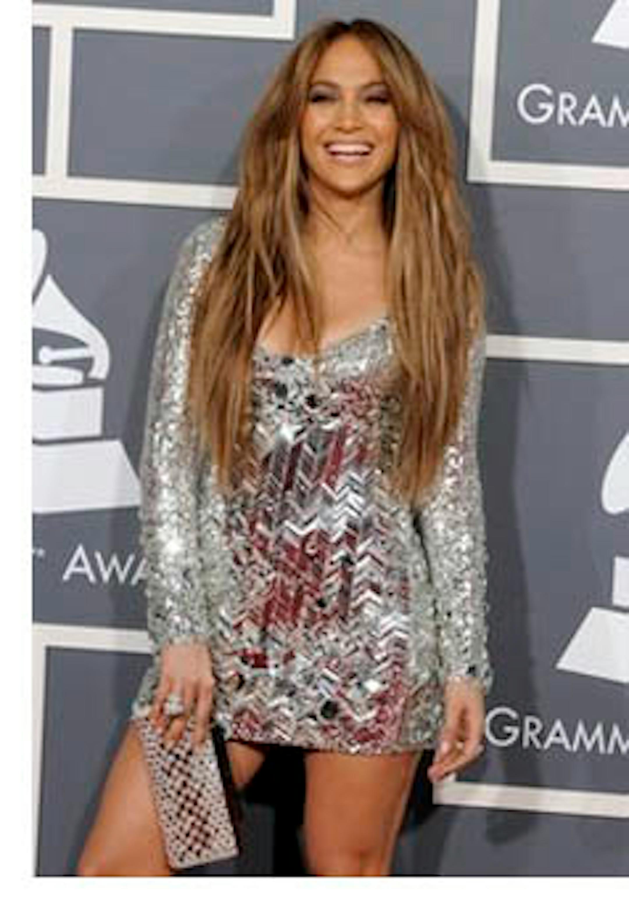 FILE - In a Feb. 13, 2011 file photo, Jennifer Lopez arrives at the 53rd annual Grammy Awards, in Los Angeles. People magazine is naming Jennifer Lopez the World's Most Beautiful Woman. The singer, actress and "American Idol" judge tops the magazine's annual list of "the World's Most Beautiful" in a special double issue.  (AP Photo/Chris Pizzello, File)