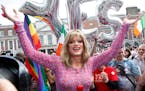 Rory O'Neill, known by the Drag persona Panti, celebrates with yes supporters at Dublin Castle, Ireland, Saturday, May 23, 2015. Ireland has voted res