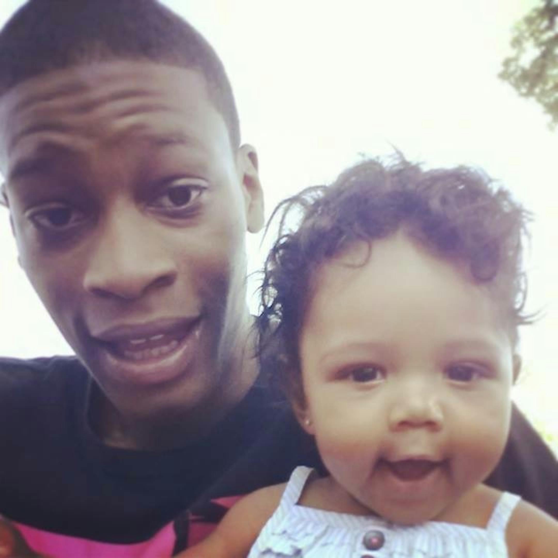 Anthony Stubbs, 23, with one of his two children.