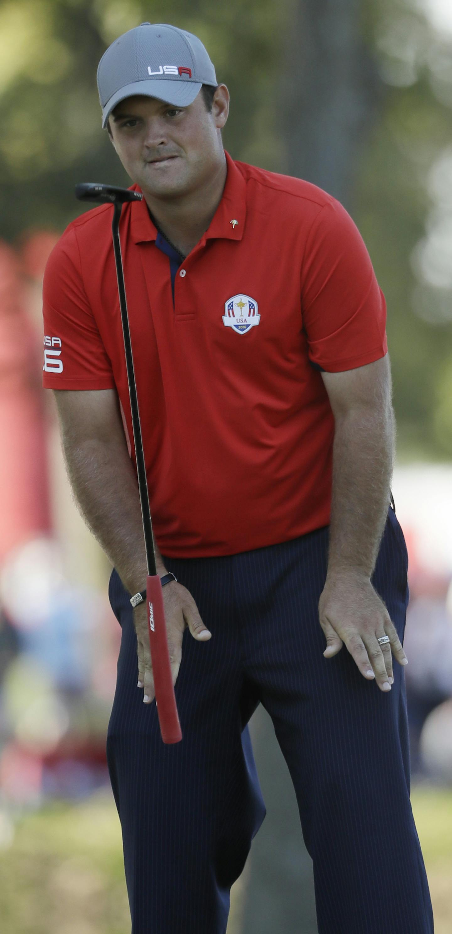 United States&#x2019; Patrick Reed flips his putter after missing a putt on the 12th hole during a four-balls match at the Ryder Cup golf tournament Friday, Sept. 30, 2016, at Hazeltine National Golf Club in Chaska, Minn. (AP Photo/David J. Phillip)