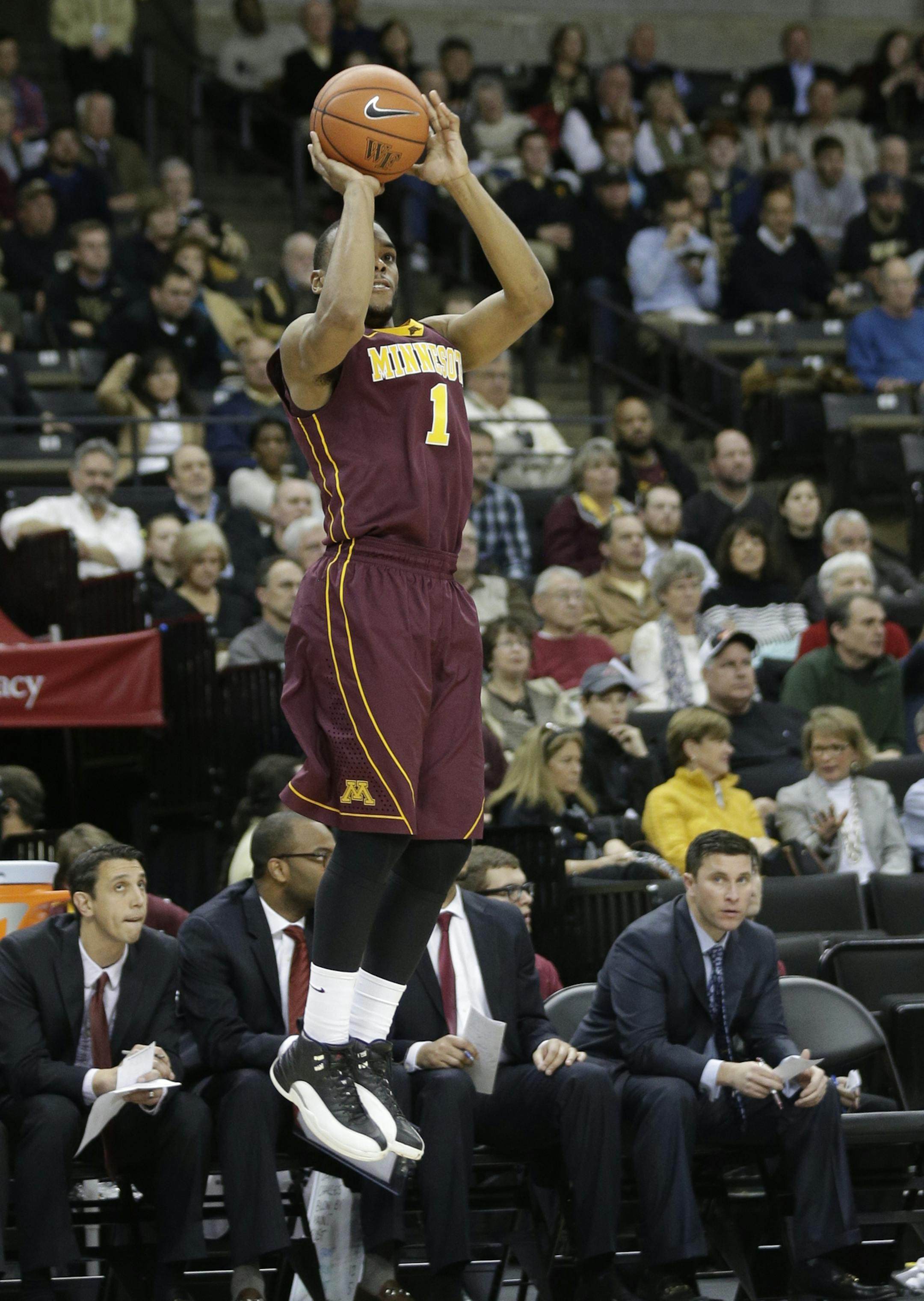 Minnesota's Andre Hollins (1) shoots against Wake Forest during the second half of an NCAA college basketball game in Winston-Salem, N.C., Tuesday, Dec. 2, 2014. Minnesota won 84-69. (AP Photo/Chuck Burton)