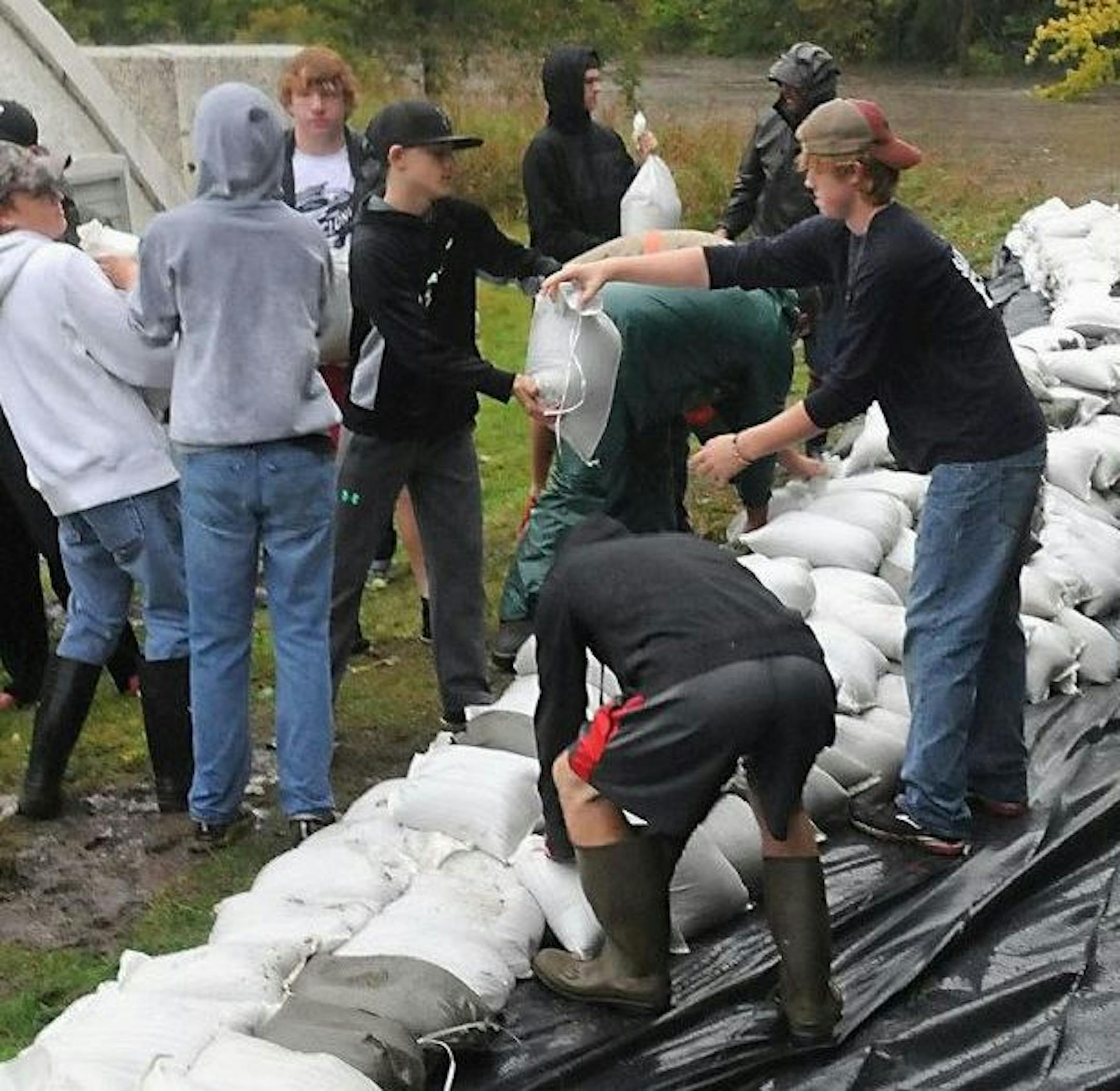 Volunteers sandbagged to protect St. Clair's water treatment plant from the rising Le Sueur River after heavy rains flooded homes, highways and infratructure after heavy rains Sept. 22.