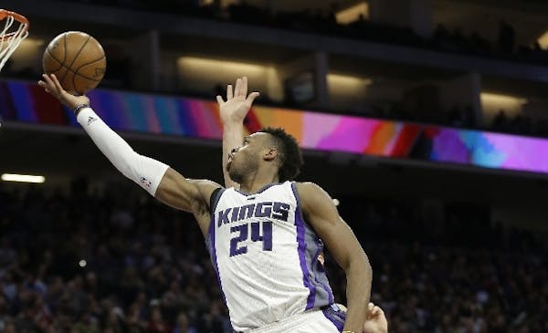 Kings guard Buddy Hield drove to the basket against Nuggets center Mason Plumlee, behind, during the second half of an NBA game Thursday.