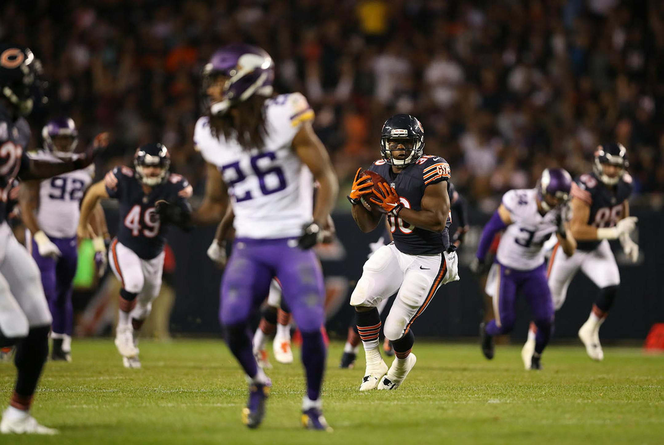 Chicago Bears running back Benny Cunningham (30) caught a pass from Chicago Bears punter Pat O'Donnell on a trick play that resulted in a 38 yard touchdown play in the third quarter.