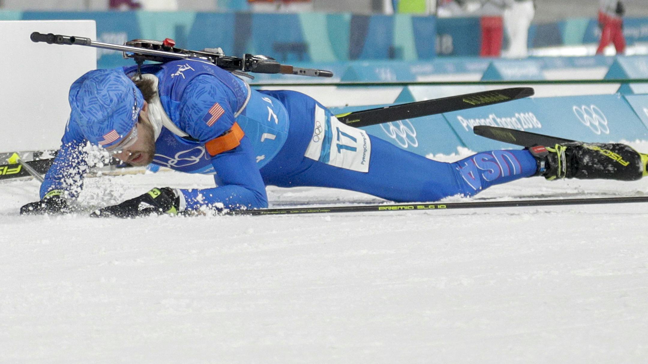 Leif Nordgren, of United States of America, collapses in the finish area after the men's 4x7.5-kilometer biathlon relay at the 2018 Winter Olympics in Pyeongchang, South Korea, Friday, Feb. 23, 2018. (AP Photo/Gregorio Borgia)