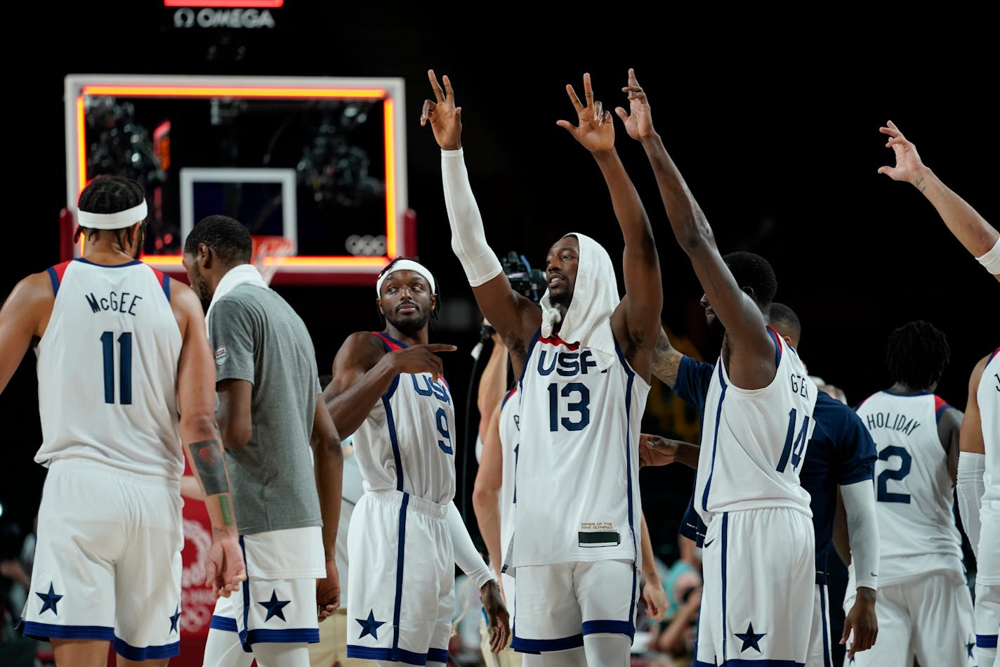 United States players celebrate their win in the men's basketball semifinal game against Australia at the 2020 Summer Olympics