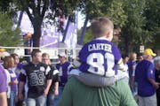 Anthony Carter's No. 81 jersey on a young Vikings fan before Friday night's game.