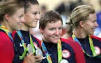 Olympic medalist Kelly Catlin, second from right, was also a three-time world champion who was beloved by the Twin Cities cyclists she trained with.