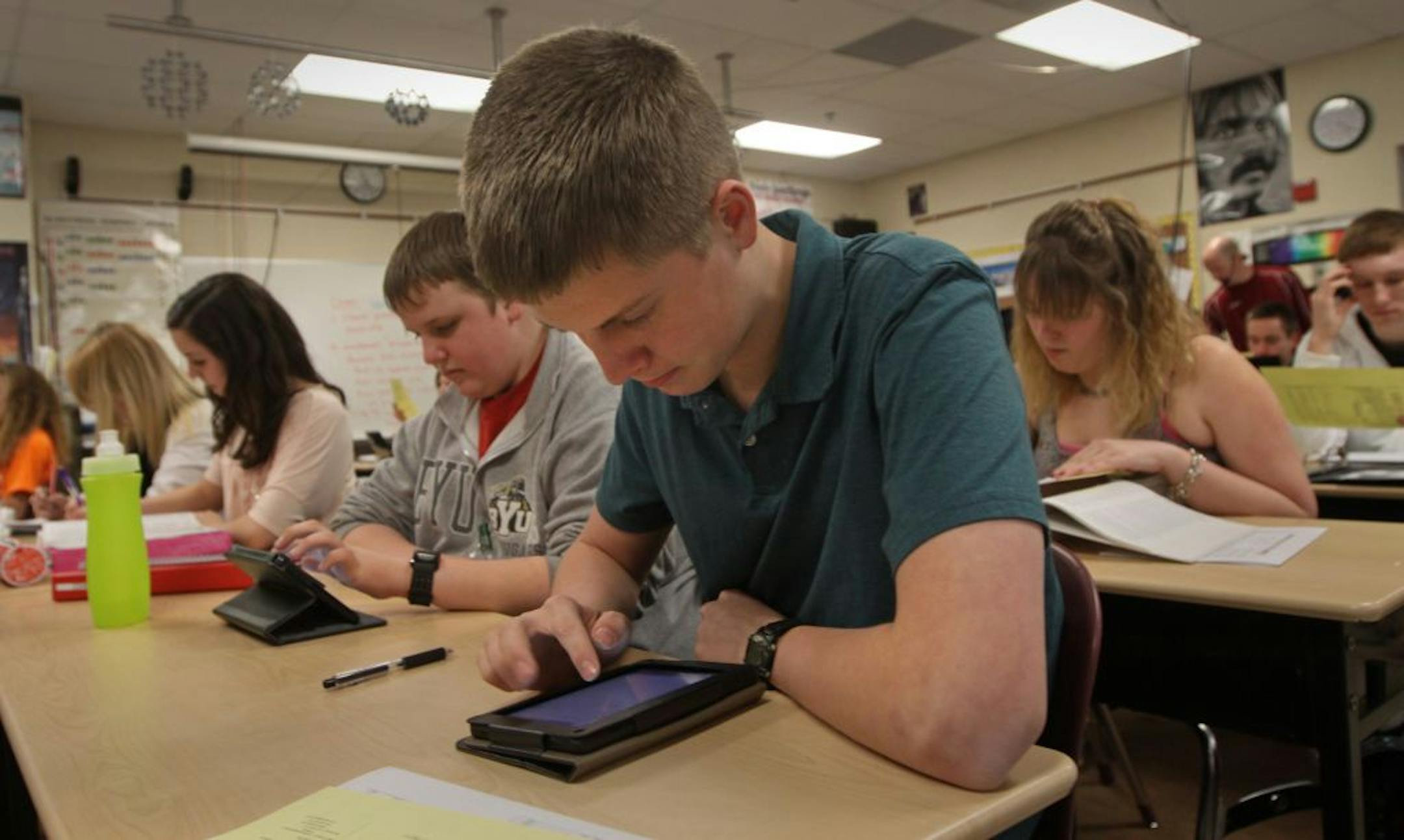 More young people are reading with digital devices like e-readers and smartphones because it's convenient.