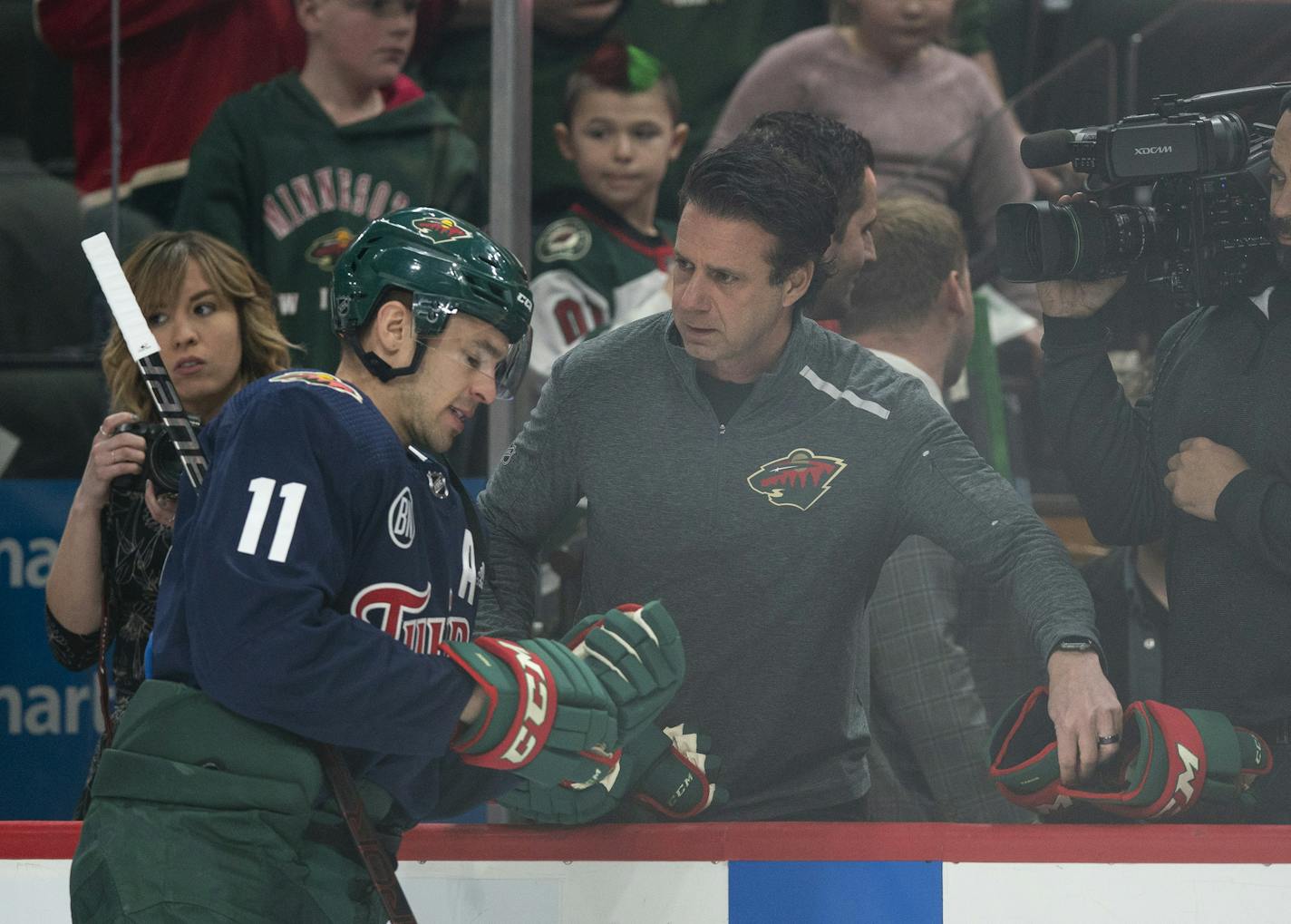 The Wild's Head Equipment Manager Tony Dacosta swapped out a pair of gloves with left wing Zach Parise (11) during pregame warmups Tuesday night. ] JEFF WHEELER &#x2022; jeff.wheeler@startribune.com The Minnesota Wild faced the Philadelphia Flyers in an NHL hockey game Tuesday night, February 12, 2019 at Xcel Energy Center in St. Paul.