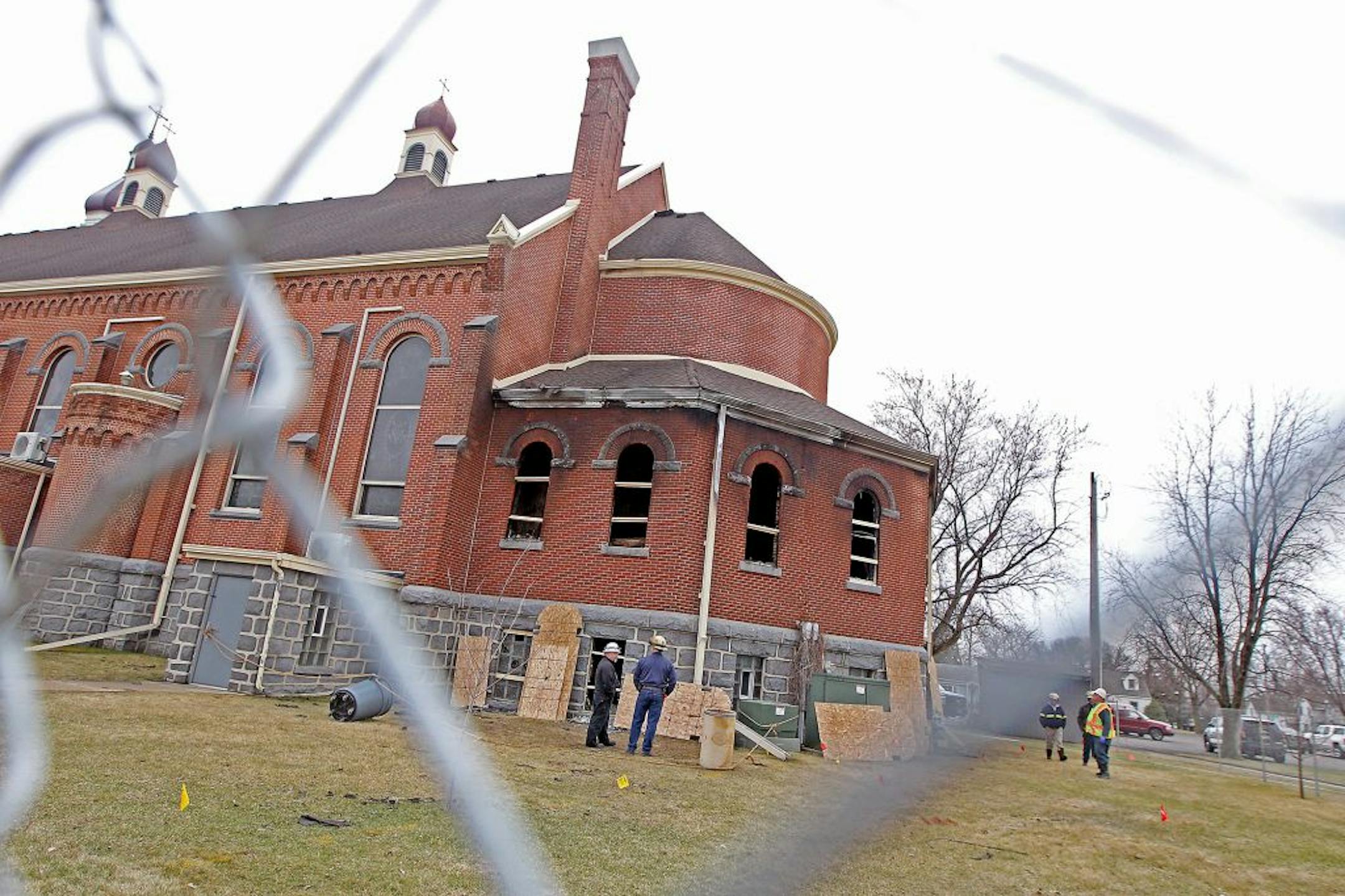 Local fire and federal agents arrived to inspect the scene where a fire damaged about 30 percent of the 120-year-old St. Mary's Catholic Church, Monday, March 14, 2016 in Melrose, MN.