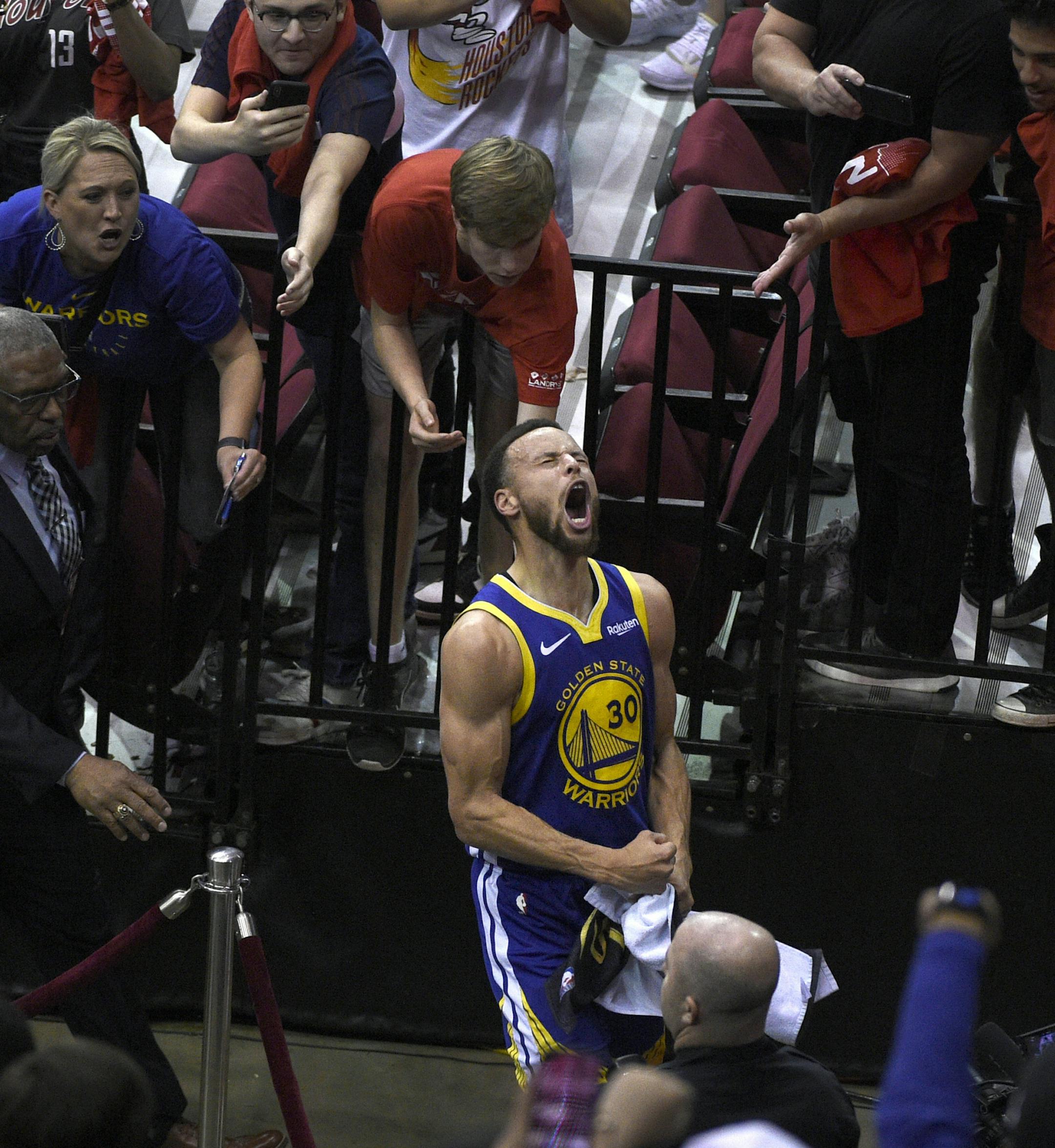 Golden State Warriors' Stephen Curry celebrates as he walks off the court following the team's 118-113 win against the Houston Rockets during Game 6 of a second-round NBA basketball playoff series, Friday, May 10, 2019, in Houston. (AP Photo/Eric Christian Smith)