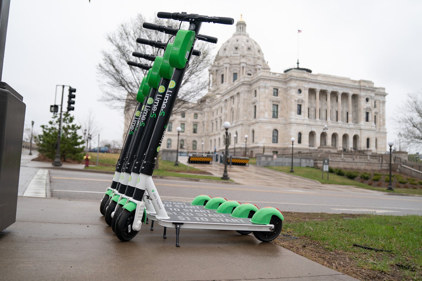 Lime scooters are lined up across the street from the Minnesota State Capitol in St. Paul. The scooters will now be available for pickup at Minneapolis' parks. ] GLEN STUBBE &#x2022; glen.stubbe@startribune.com Tuesday, April 30, 2019 EDS, available for any appropriate use.