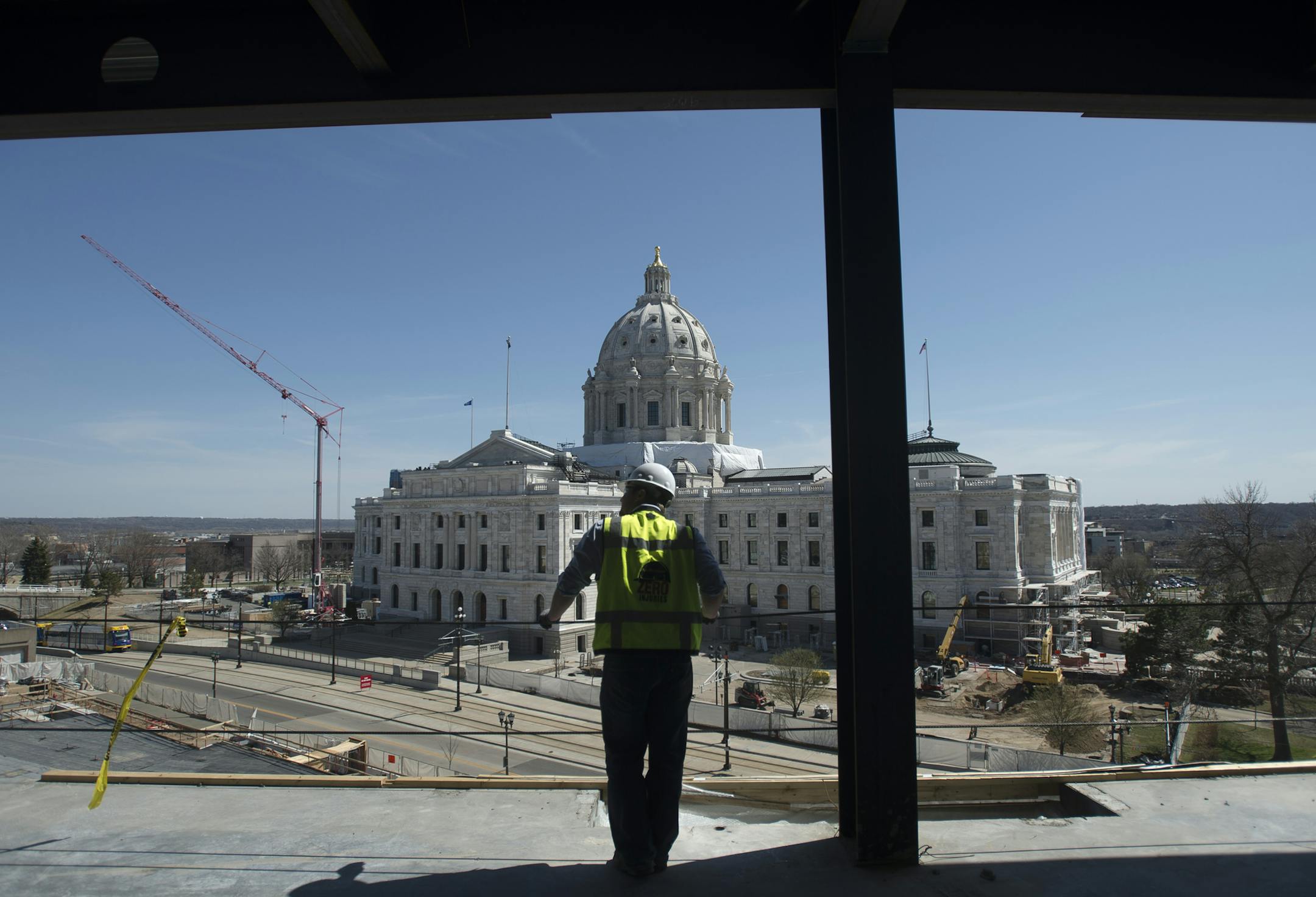 Greg Huber, senior project manager with Mortensen Construction overseeing the Senate Office Building project, looks on while standing on the top floor of the new building on Tuesday afternoon. ] (Aaron Lavinsky | StarTribune) aaron.lavinsky@startribune.com Mortenson Construction gave the media a tour of the new Senate Office Building construction, a project that has been criticized over spending by Republicans. The building is being built in conjunction with the capitol renovation and will house