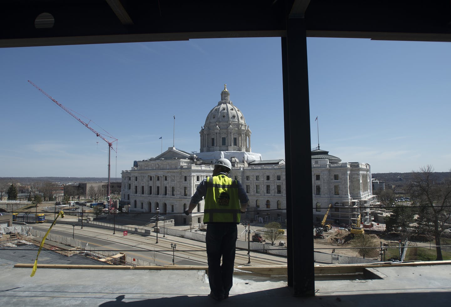 Greg Huber, senior project manager with Mortensen Construction overseeing the Senate Office Building project, looks on while standing on the top floor of the new building on Tuesday afternoon. ] (Aaron Lavinsky | StarTribune) aaron.lavinsky@startribune.com Mortenson Construction gave the media a tour of the new Senate Office Building construction, a project that has been criticized over spending by Republicans. The building is being built in conjunction with the capitol renovation and will house