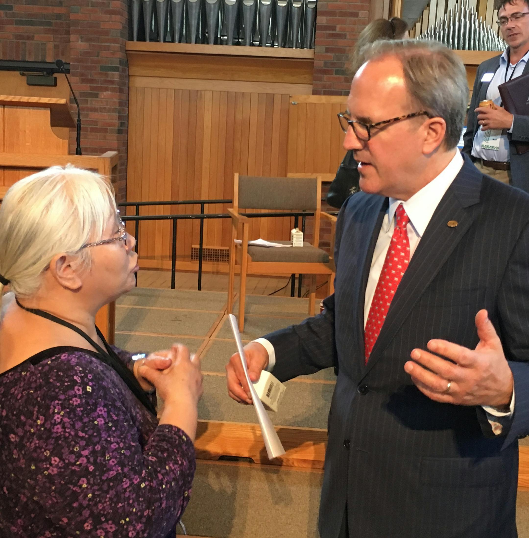 Ecolab CEO Doug Baker (right), following a discussion in September on the commercial, environmental and theological implications of water usage at the Nobel Forum at Augsburg University. Photo: Neal.St.Anthony@startribune.com