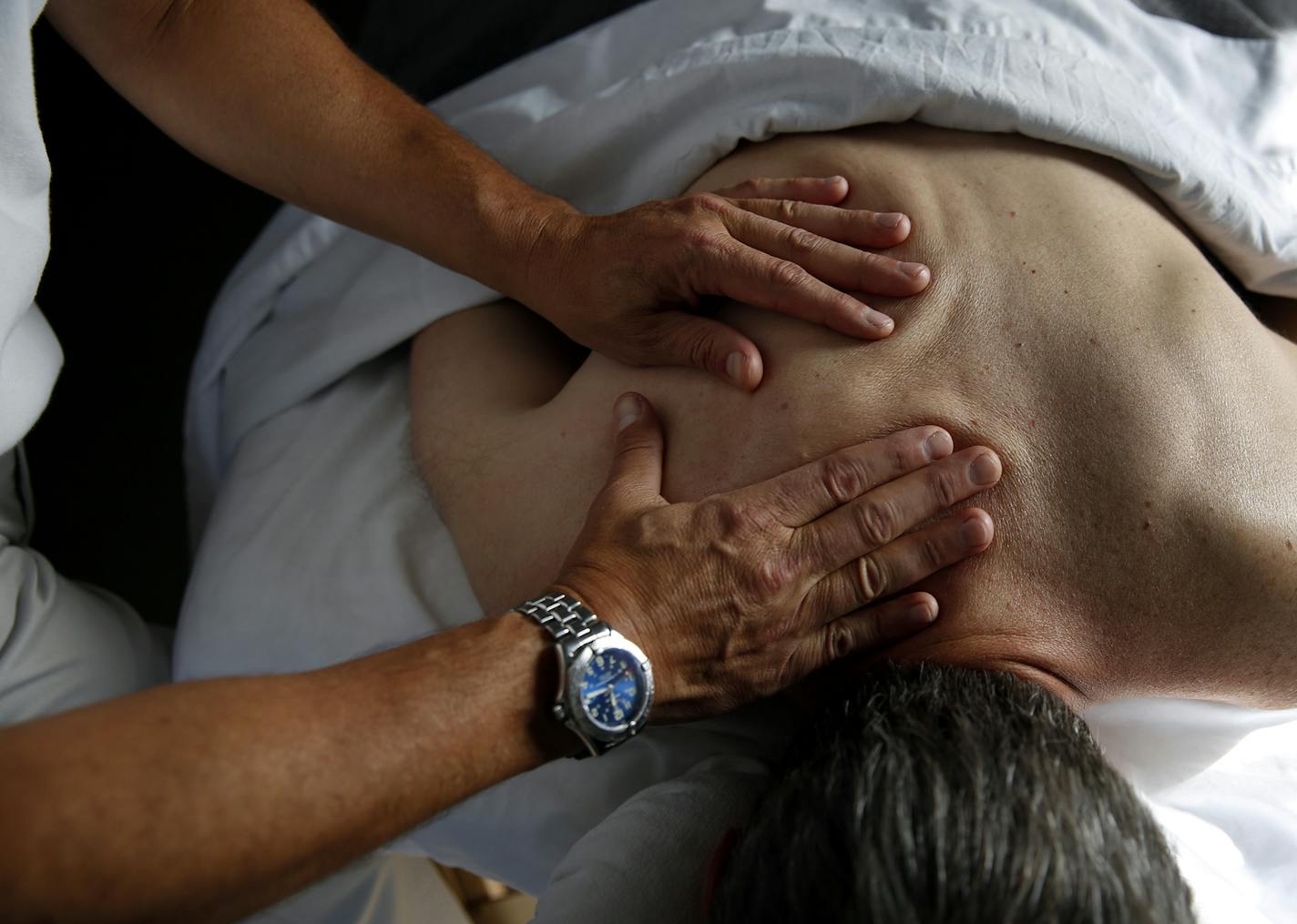 Jeff Goldstein works on a client inside his studio Uptown Massage in Minneapolis. ] LEILA NAVIDI leila.navidi@startribune.com / BACKGROUND INFORMATION: Thursday, October 9, 2014. After 32 years as a futures trader, Jeff Goldstein decided to try something different. He became a massage therapist who specializes in helping people with special needs, including drug addicts and clients with life-threatening illnesses. ORG XMIT: MIN1410111635297250