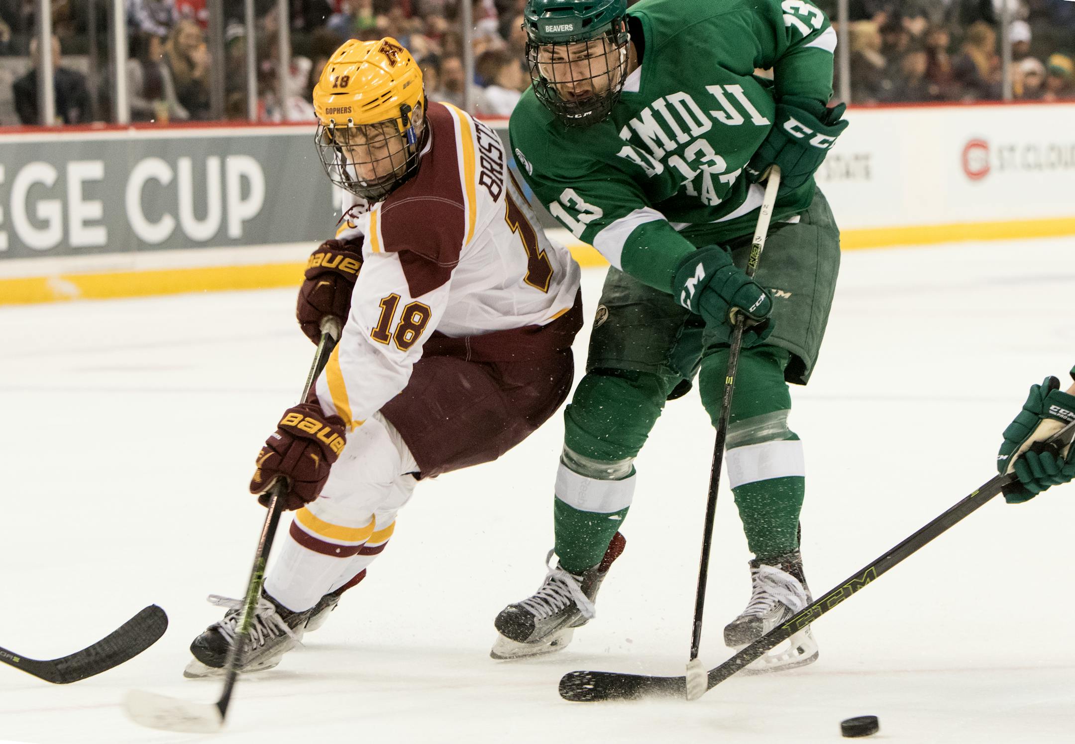 Gophers forward Leon Bristedt (18) has the puck taken away by Bemidji State forward Cory Ward (13) on January 30, 2016 at Xcel Energy Center in St. Paul.