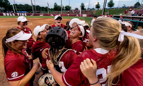 Alabama celebrates after clinching a super regional trip during an NCAA college regional final softball game against Minnesota Sunday, May 21, 2017, i