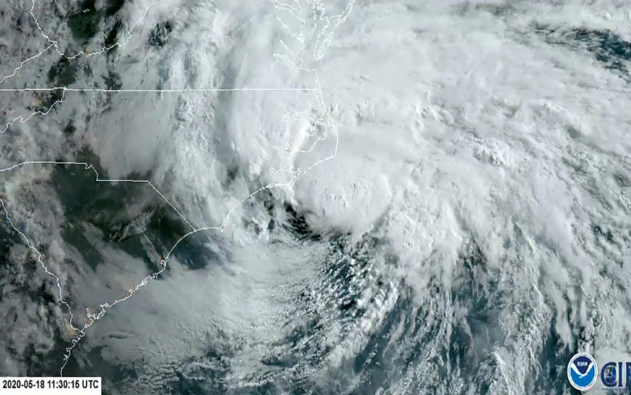 In this satellite image made available by NOAA shows Tropical Storm Arthur off the coast of North Carolina, Monday, May 18, 2020. The storm dropped several inches of rain on parts of eastern North Carolina and flooded roads before moving out to sea away from the state. (NOAA via AP)