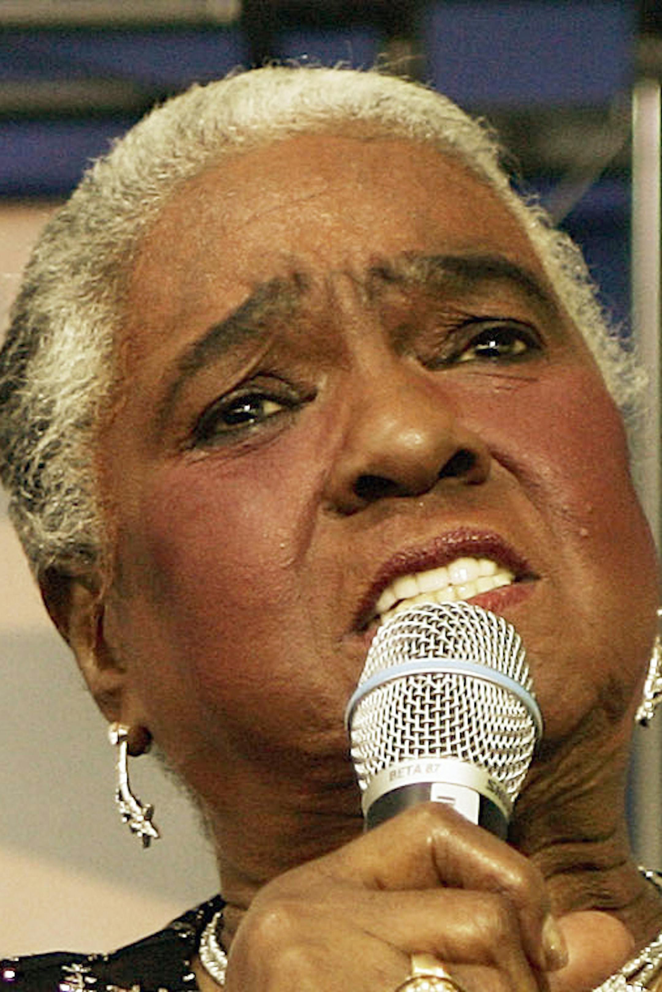 FILE - In this Jan. 25, 2006 file photo, jazz and blues singer Linda Hopkins performs during a ceremony unveiling a new postage stamp honoring Hattie McDaniel, the first African American to win an Academy Award for her role in "Gone With the Wind,"in Beverly Hills, Calif. Hopkins, who won a Tony Award in 1972 for the musical "Inner City," has died Monday, April 10, 2017, in Milwaukee, Wis., according to her great-niece Hazel Lindsey. She was 92. (AP Photo/Damian Dovarganes, File)