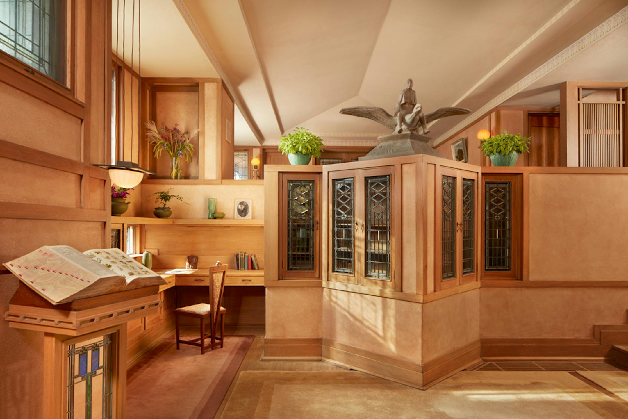 Purcell-Cutts House, 2328 Lake Place, Minneapolis, Minnesota, 1913, William Gray Purcell, Architect.George Elmslie, George Feick Jr. partners in firm Purcell, Feick and Elmslie, Edna S. Purcell House, Prarie School Style, Open floor plan, Art Glass windows, Writing Nook, Fireplace wall Mural by Charles Livingston Bull, Louisana Herons Flying with two Moons, Iridescent glass mortered in frieplace base, Stencil pattern, Peak a Book stained glass entry, Grandfather Gray portrait by Lawton Parker in Entrance Hall, Dining room Art Glass double door to screend-in Porch, Reflecting Pool and landscape designed by Harry Franklin Baker, Living room, Stair Hall, Master Suite, Sleeping Porch, Built in cedar floor storage, fireplace, childrens room connected to master with accordian style operating partition, sunken Living room,tent Ceilings, Ceiling Lights and art glass by Mosaic Art Shops Minneapolis, Maid Call Button, Air conditioning, Central vacuum system, sliding kitchen door operated by foot button, icebox in kitchen with door to outside, custom Sitting chair, Custom Floor lamp, Custom Dining room table,chairs and sideboard, Custom Cluster Pendant lighting, Oak hardwood floors and trim, Custom Throw rugs, Continuous tented roof and ceiling, Elevated dining room, dropped floor living room, "Little Joker", Personalized home with monogram ESP for Edna S. Purcell,