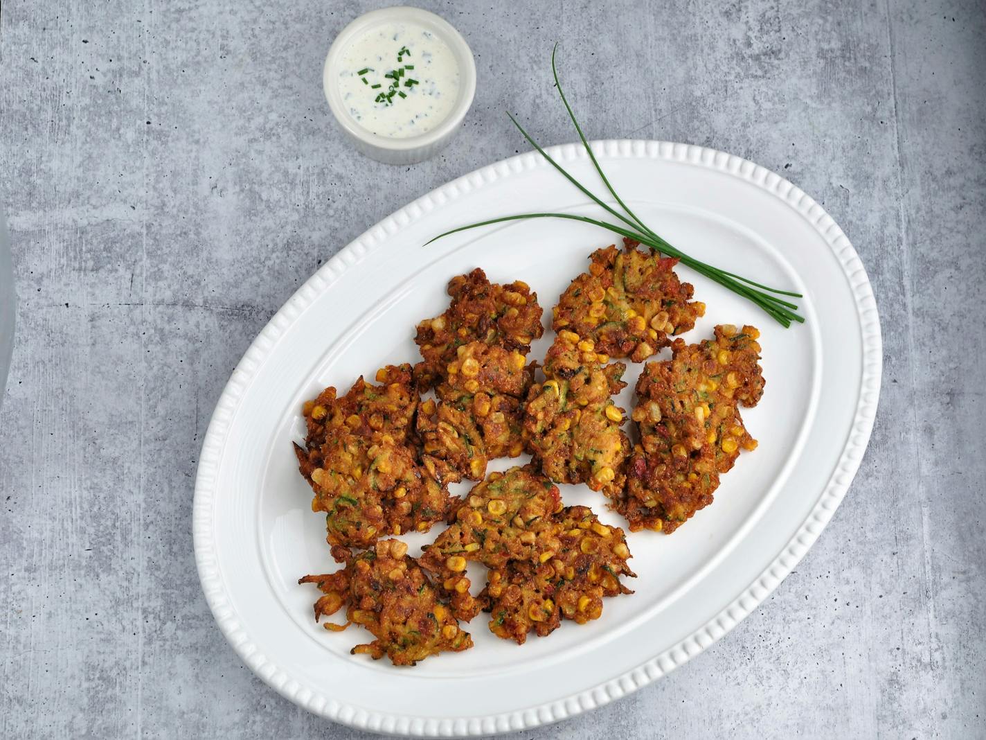 Corn and Zucchini Fritters with Parmesan Chive Dipping Sauce. Recipe and photo by Meredith Deeds, Special to the Star Tribune