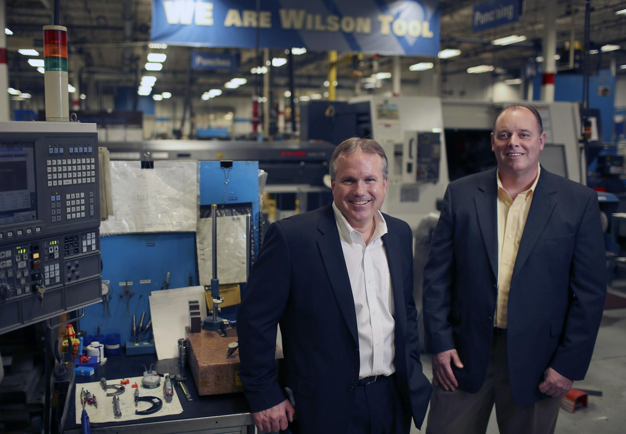 Family owned Wilson Tool International is hunting for other small manufacturers who can take the White Bear Lake firm into new industries. Paul Johnson, President of Corporate Development, left, with Brian Robinson, CEO, are heading the new Wilson Venture Group, a $40 million venture capital fund that will be used to buy small manufacturers. They're on a the floor of their plant Thursday afternoon, February 27, 2014 in White Bear Lake. ] JEFF WHEELER ‚Äö√Ñ¬¢