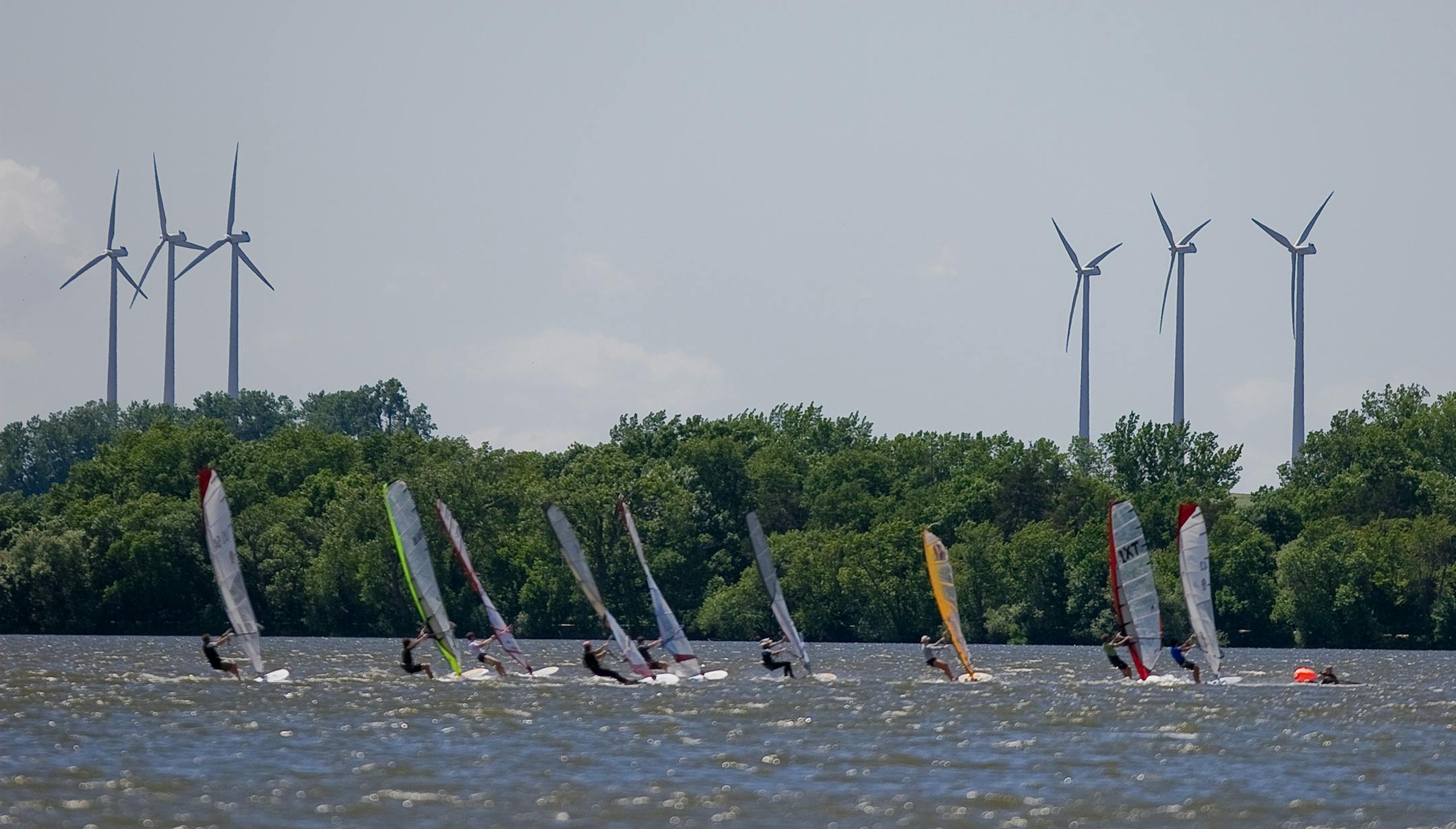 Photo by Dan Norman. Windsurfers on Lake Okabena in Worthington.