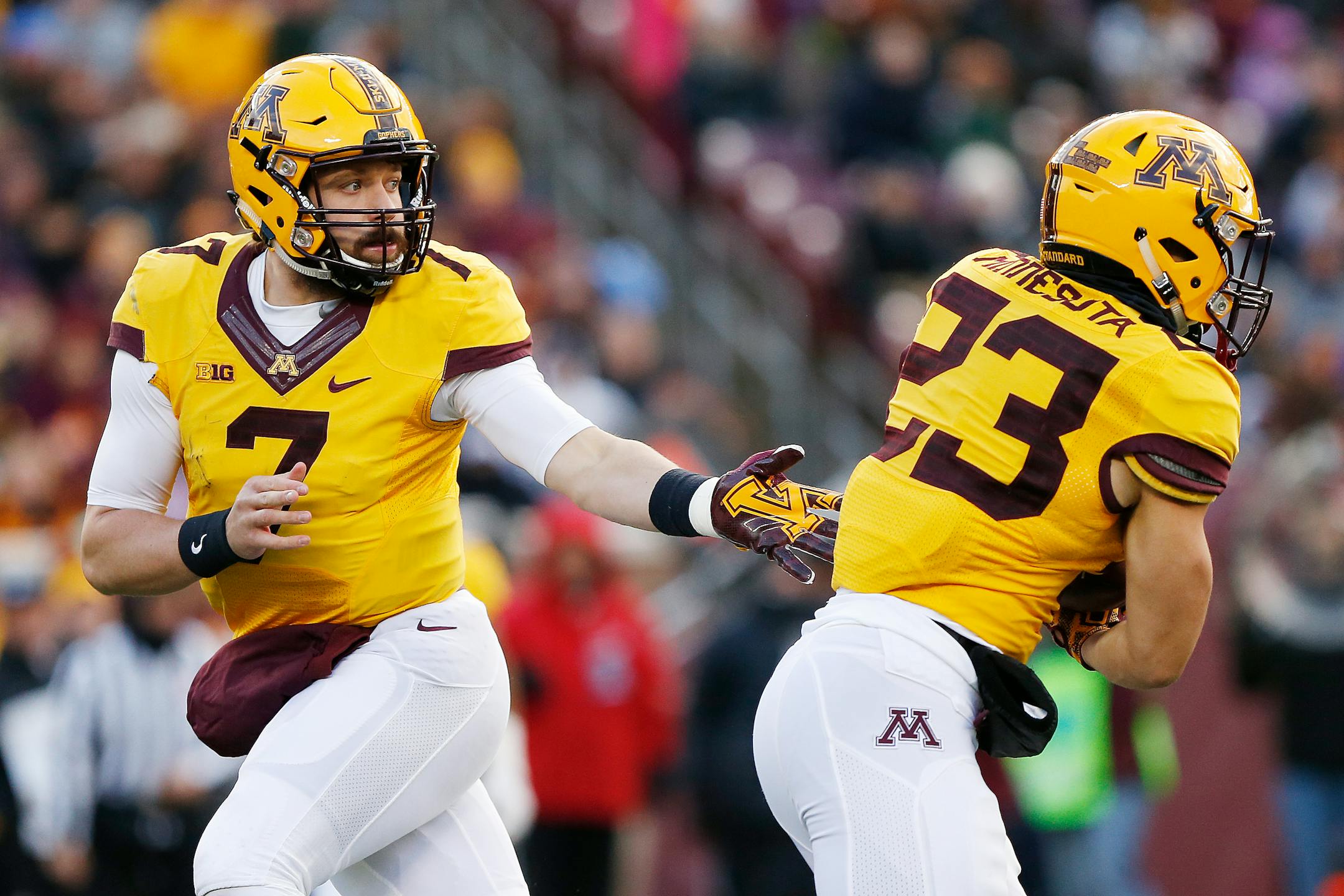 Minnesota quarterback Mitch Leidner hands the ball off to running back Shannon Brooks against Northwestern. A run-run-pass approach against potent Wisconsin on Saturday won't do the trick.