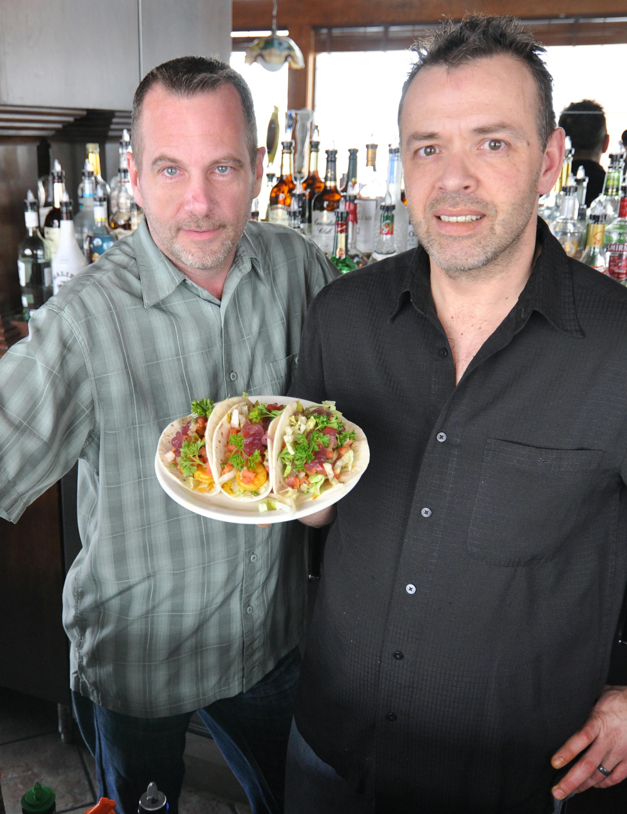 Photo by Liz Rolfsmeier Ernie's Pub and Grill, run by co-owners Bryan Prettyman (left) and John Pleschourt (right), opened up a year and a half ago in Burnsville.