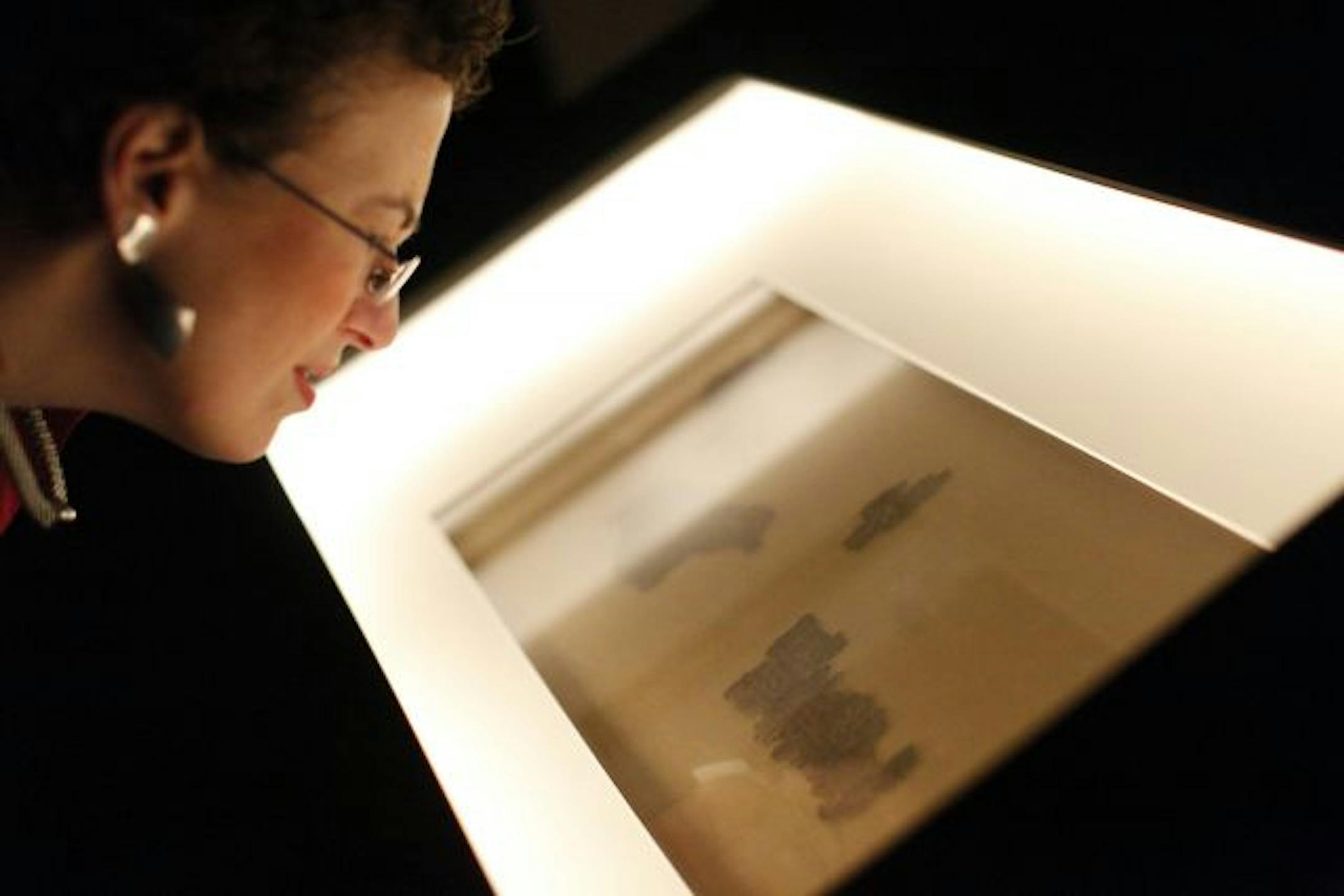 Rabbi Lynn Liberman of the Beth Jacob Congregation in Mendota Heights viewed the Dead Sea Scrolls during a preview event in March.