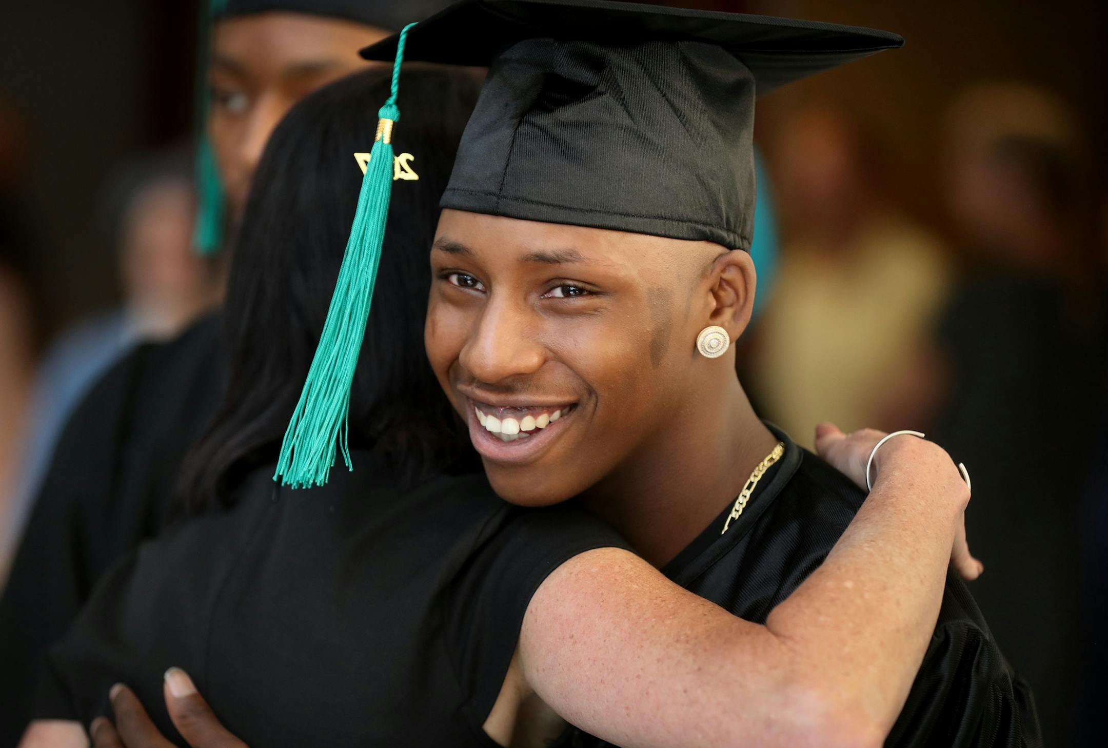 Chris Davis, 18, hugged former social worker Pam Russ, who started graduation ceremony as a way to acknowledge the students’ successes. "It's a philosophy of looking at their strengths," she said.