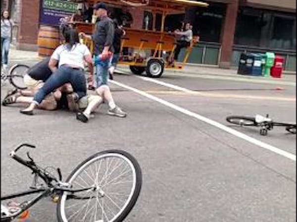A frame grab from a YouTube video shows bicyclists being taken down by off-duty police officers who were on a Pedal Pub in Minneapolis.