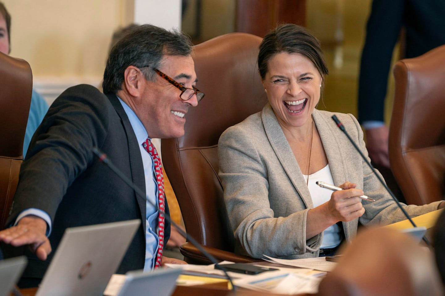 Sen. Rick Bennett, R-Oxford, left, and Assistant Senate Minority Leader Sen. Lisa Keim, R-Dixfield, share a laugh during the morning Senate session We