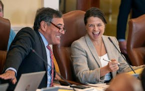 Sen. Rick Bennett, R-Oxford, left, and Assistant Senate Minority Leader Sen. Lisa Keim, R-Dixfield, share a laugh during the morning Senate session We