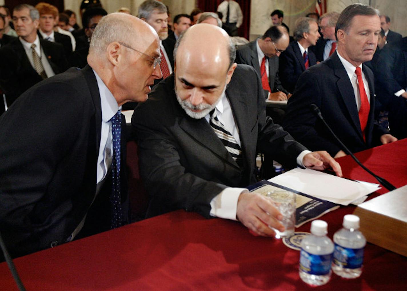 U.S. Treasury Secretary Henry Paulson, left, and Federal Reserve Board Chairman Ben Bernanke huddled before congressional testimony last summer.